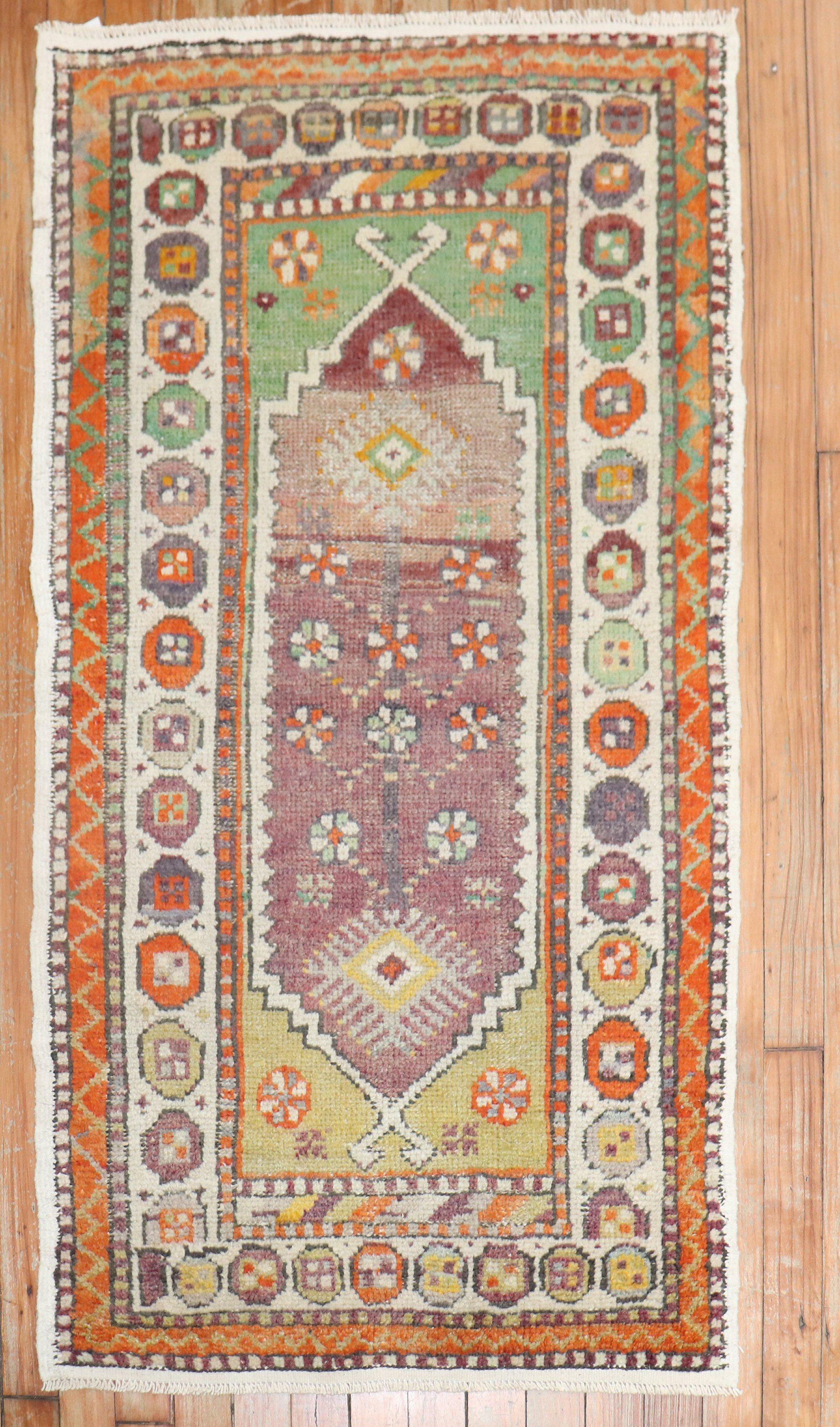 Mid-20th century Anatolian Turkish rug primarily in purple

Measures: 2'4'' x 4'2''.