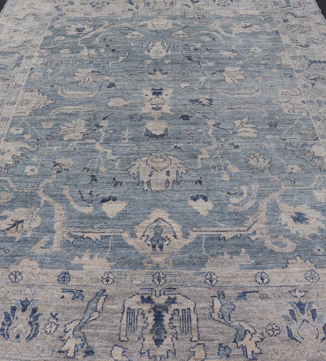 Turkish Angora Oushak Rug in Dusty Blue Background and Silver Border. Keivan Woven Arts / rug AN-151115, country of origin / type: Turkey / Oushak. Antique reproduction Ushak, angora Oushak.
Measures: 9'2 x 11'7
The angora collection is made with