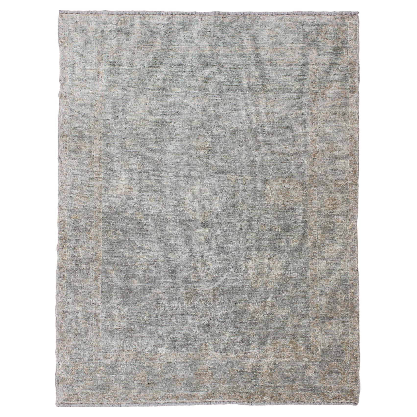 Turkish Angora Oushak Rug with Soft Green Field and Subtle Tan Accents For Sale