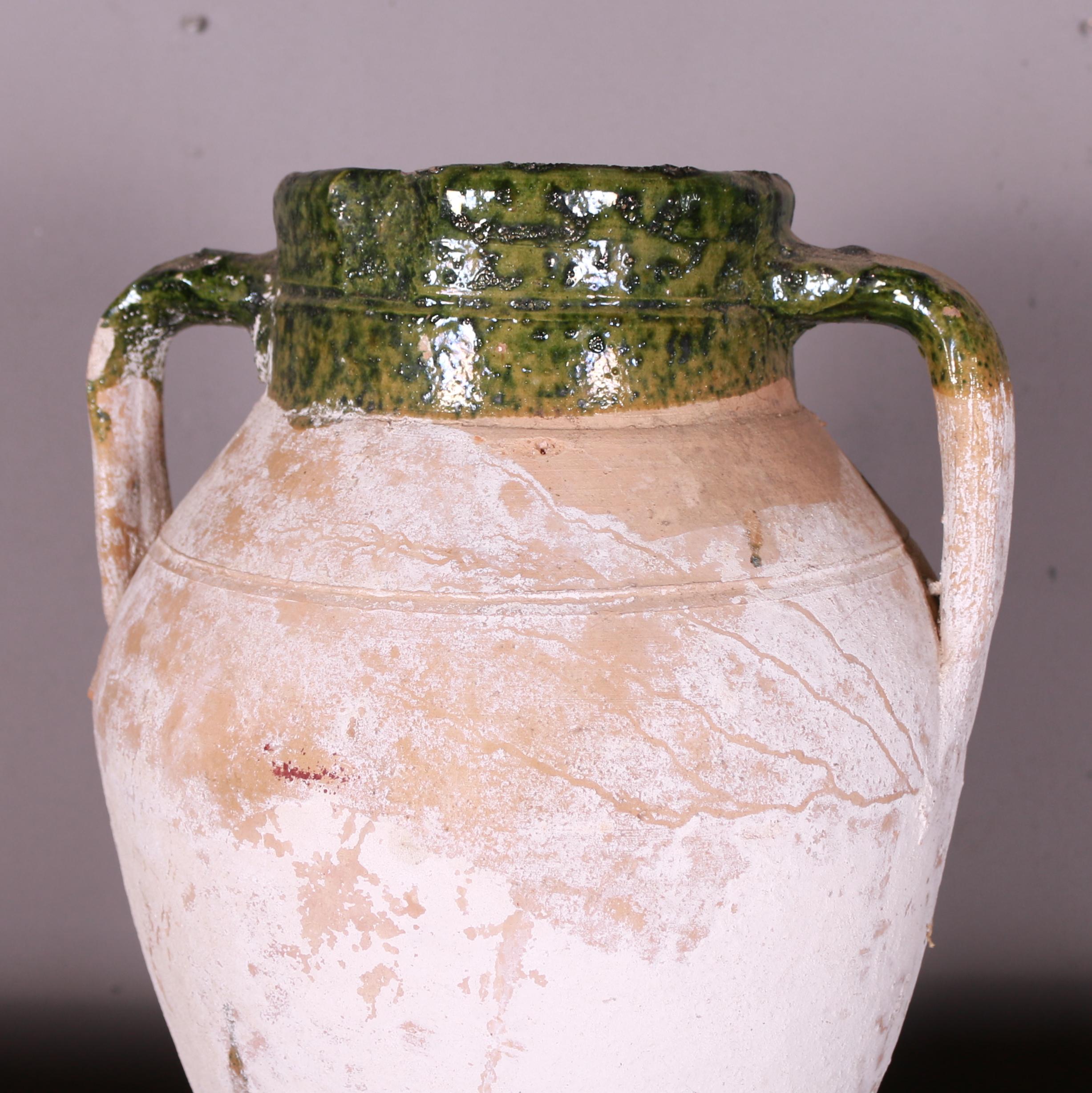 Turkish antique water pot with green glaze and original white paint. 1900

Dimensions
16 inches (41 cms) high
11 inches (28 cms) diameter.

     