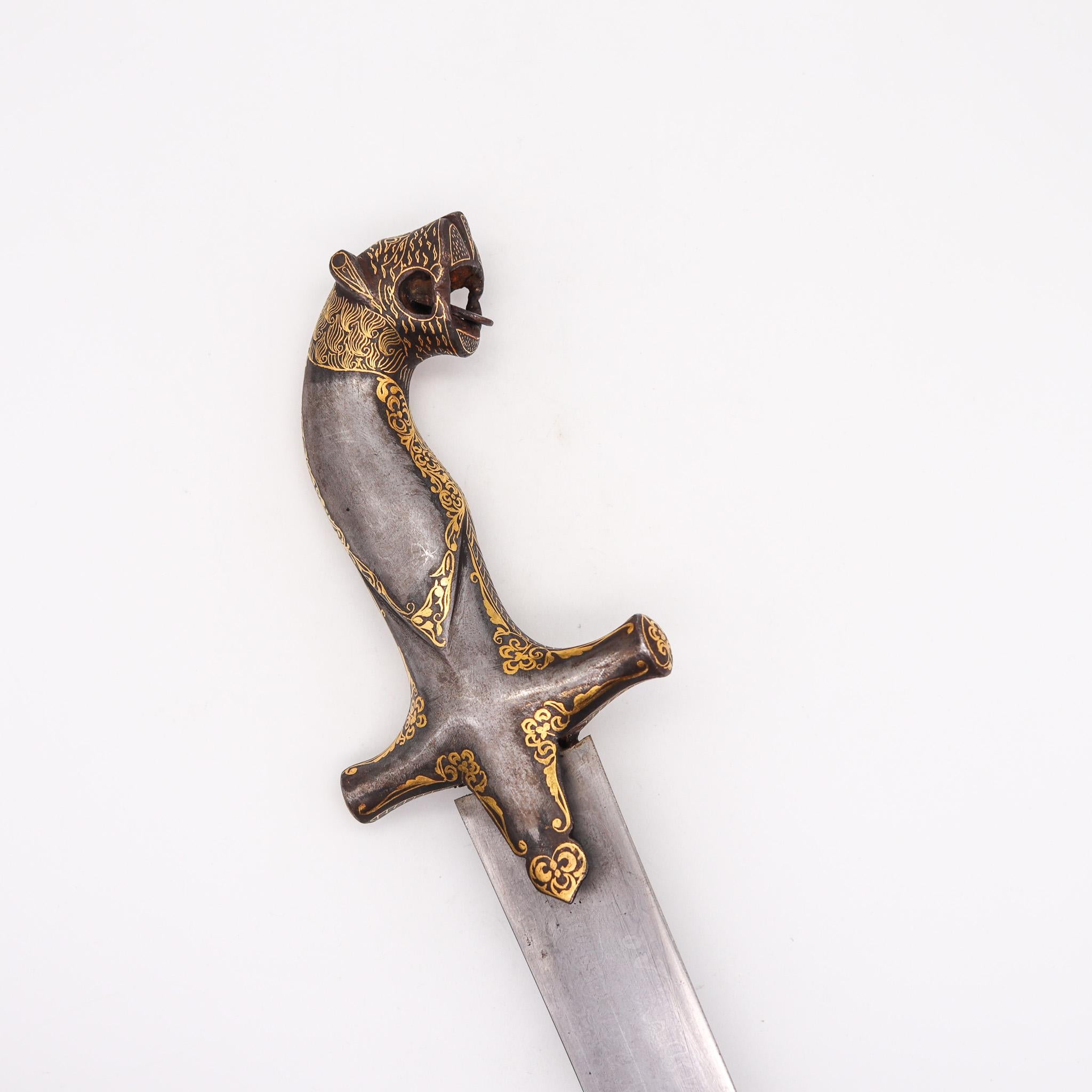 Damascene forged steel dagger with sheath.

Beautiful dagger (Jambiya) from the Ottoman empire, of Turkish / Arab origin, circa early 1800's. Created with forged Damascus wootz steel and damascene of 24 carats yellow gold. It is composed by three