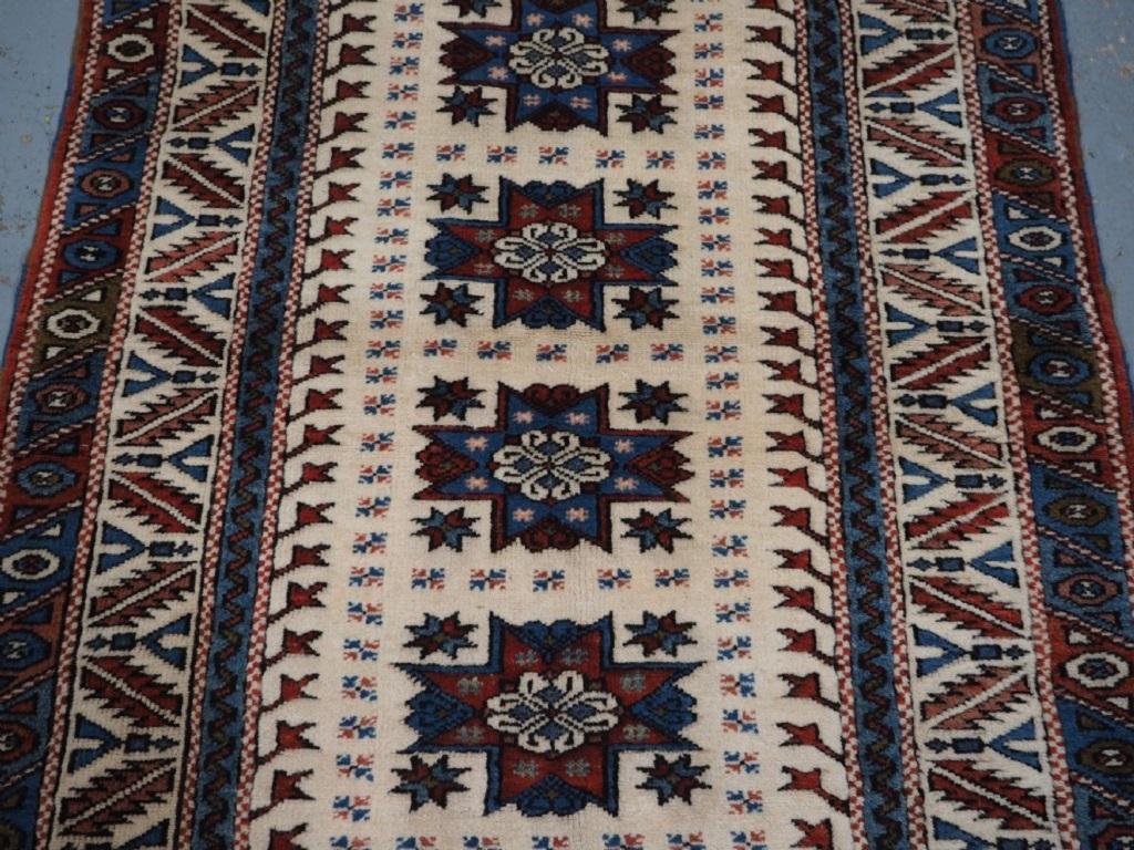 Old Turkish Bergama village rug of classic design with four star medallions
About 40 years old

The rug has four star medallions on a ivory ground, the main border is of a classic leaf design The rug retains the original kilims at both ends

The rug