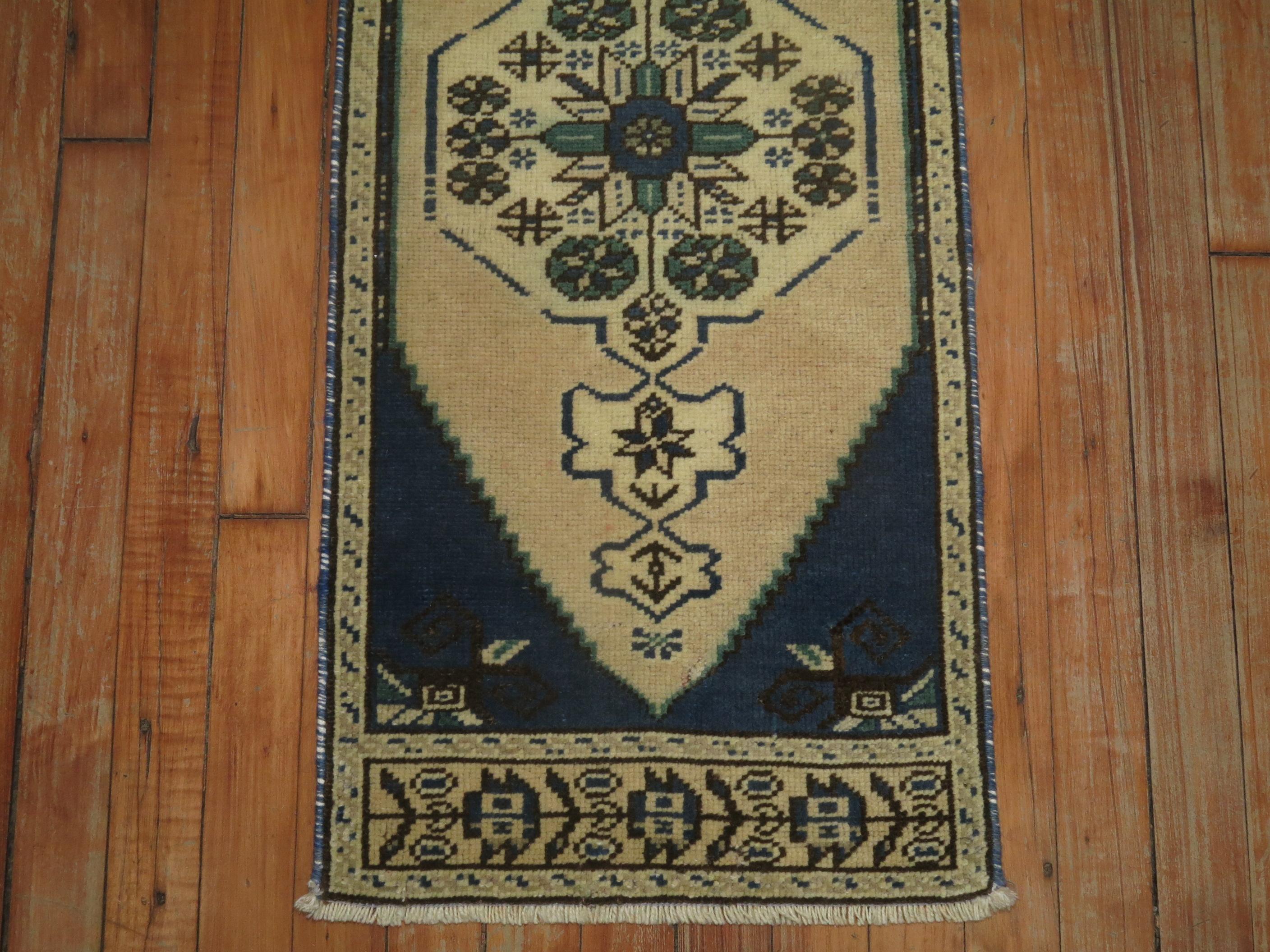 A one of a kind vintage Turkish rug with a deep blue accent you don't typically find in older Turkish rugs.