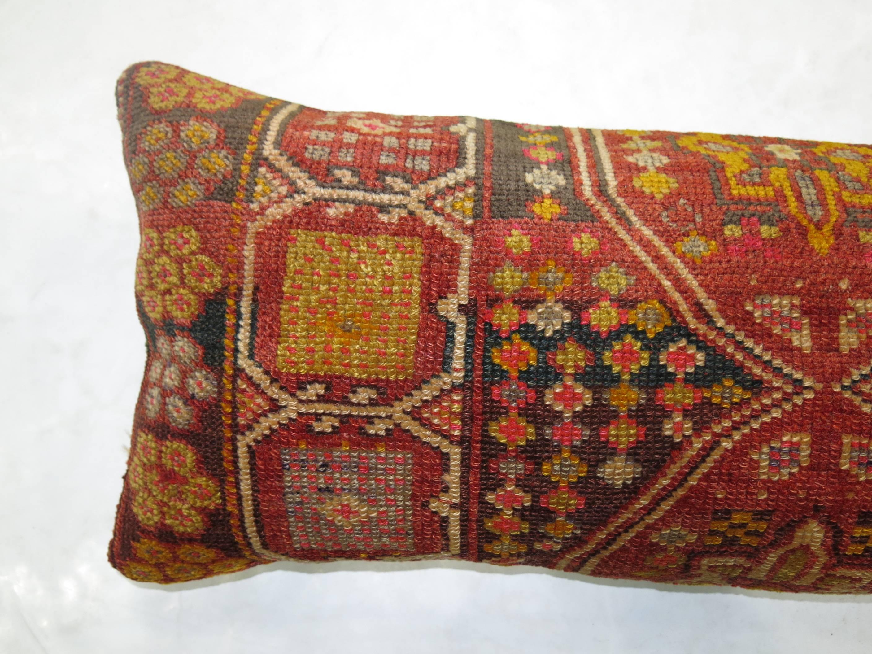 Pillow made from a 20th century Turkish rug. Measures: 14'' x 36''.