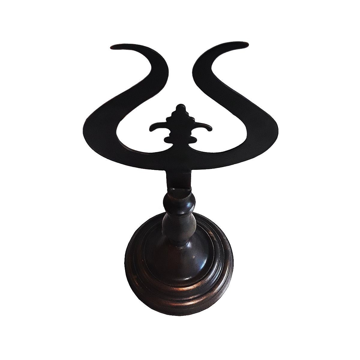 A cast brass Finial from Turkey, mounted on a circular base. Measures: 18 1/4