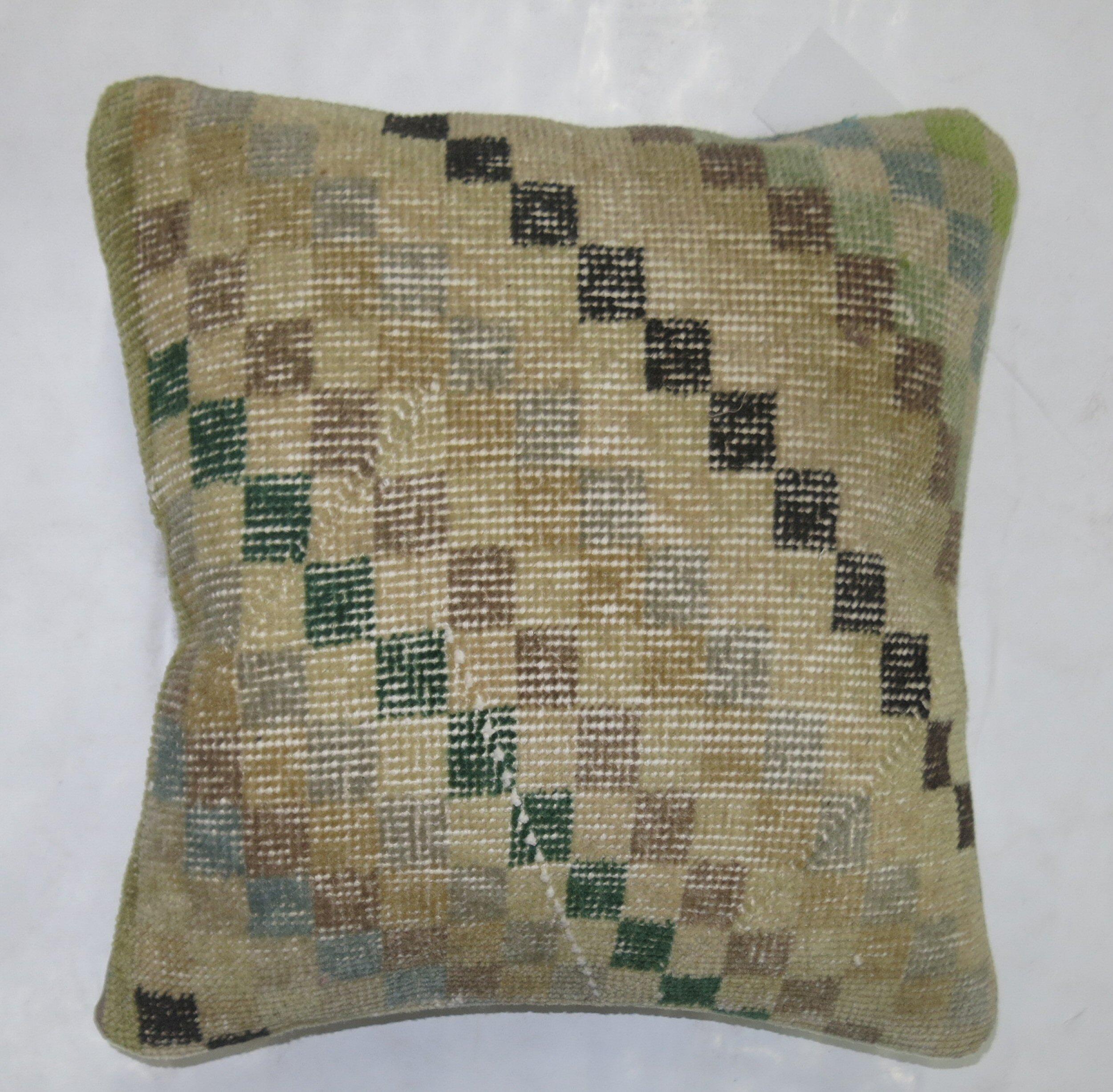 Pillow made from a Turkish Deco rug with a checkerboard motif

Measures: 18'' x 18''.