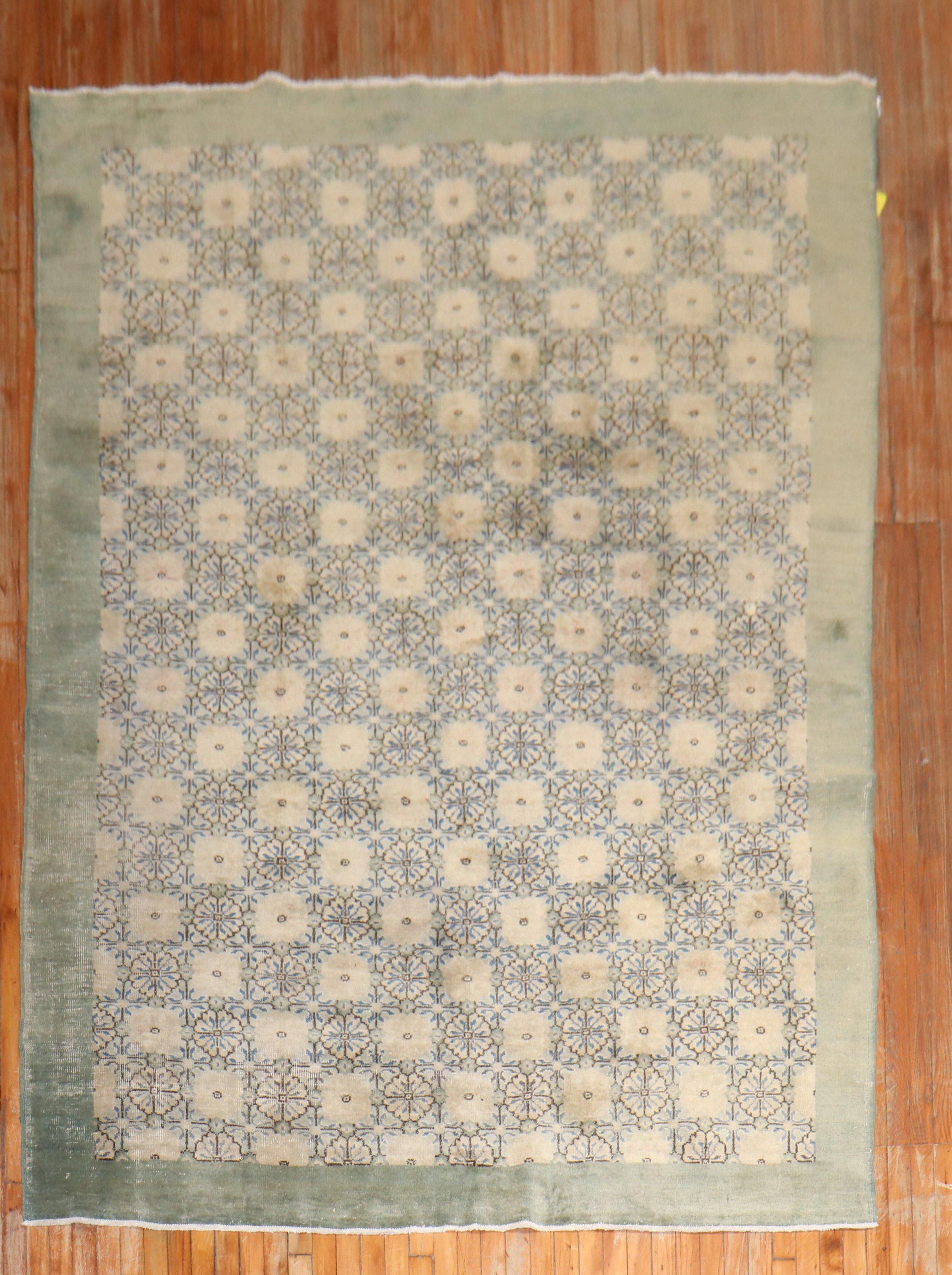 Mid-20th century Turkish Deco rug with a floral design in green, blue, and ivory

Measures: 6'10''x 9'8''.