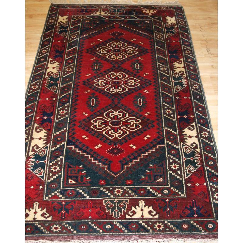 A Turkish Dosemealti rug of the traditional design for this town.

A example with a three medallion design, with excellent colour including a very clear red with ivory highlights. The border designs are very well drawn.

An excellent furnishing