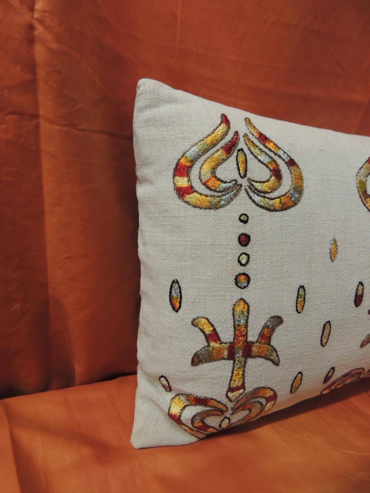 Turkish embroidered accent lumbar vintage pillow. The textile on the throw pillow textile is embroidered silk on linen. Throw pillow finished with natural linen backing. Textile panel in this decorative pillow in shades of yellow, red, natural,