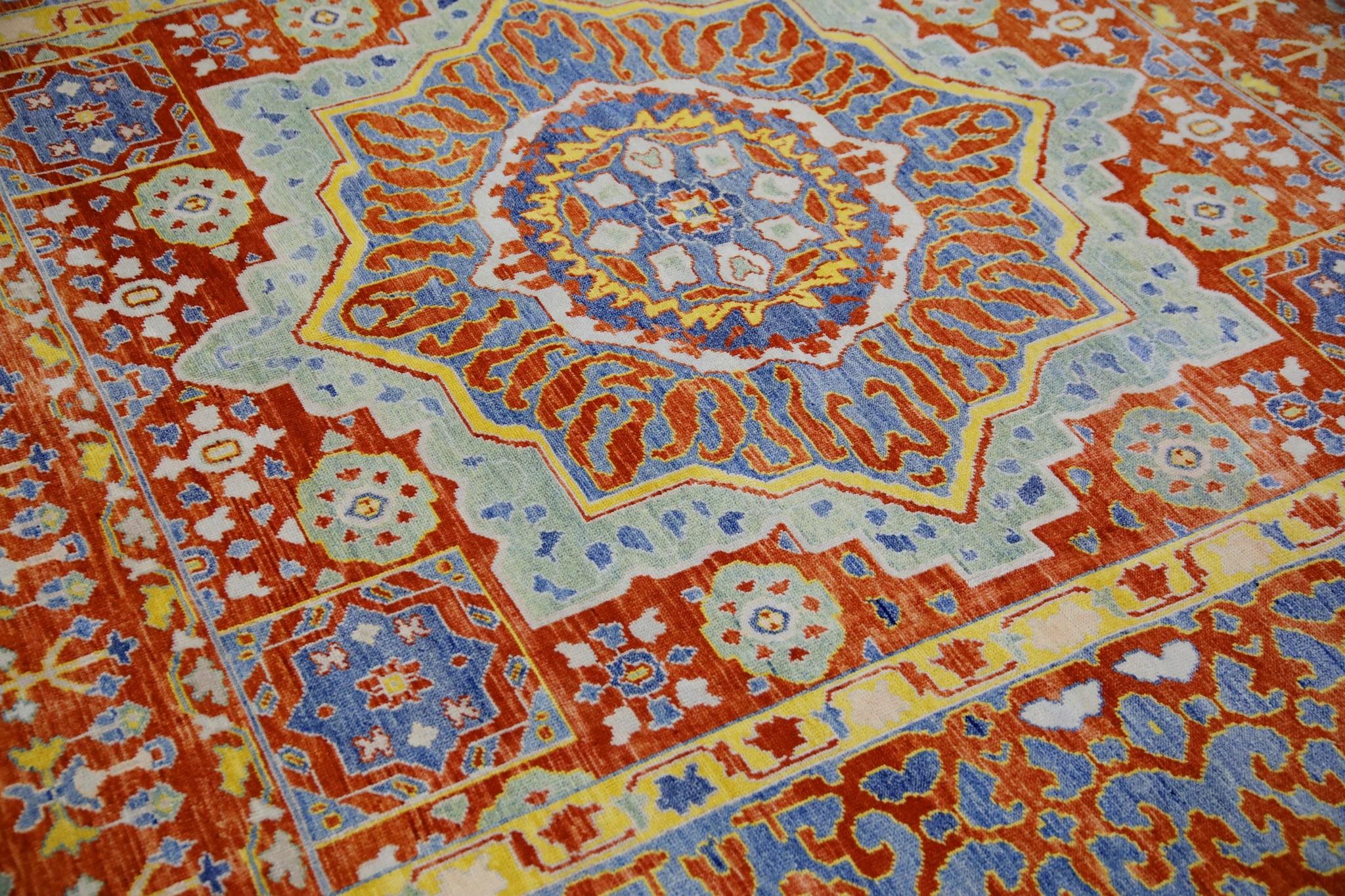This Turkish fine woven oushak rug is a stunning piece of art that has been handwoven using traditional techniques by skilled artisans. The rug features intricate patterns and a soft color palette that is achieved through the use of natural