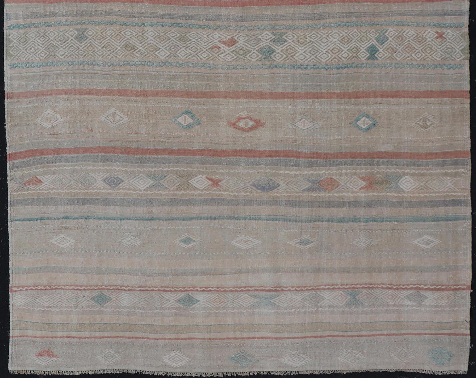 Vintage flat-weave Kilim with embroideries with a modern design in tan, brown, green and cream. geometric stripe design Vintage Kilim from Turkey, Keivan Woven Arts / rug EN-13957, country of origin / type: Turkey / Kilim, circa 1950

Measures: