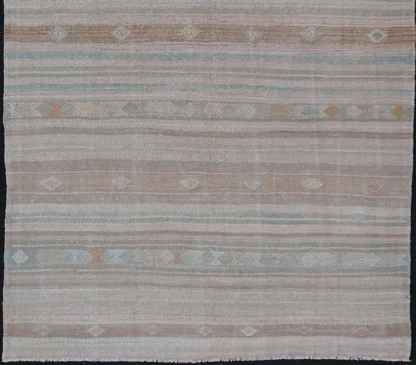 Vintage flat-weave Kilim with embroideries in tan, light green, and grey with a modern design.
geometric stripe design Vintage Kilim from Turkey, Keivan Woven Arts / rug EN-13981, country of origin / type: Turkey / Kilim, circa 1950

Measures: