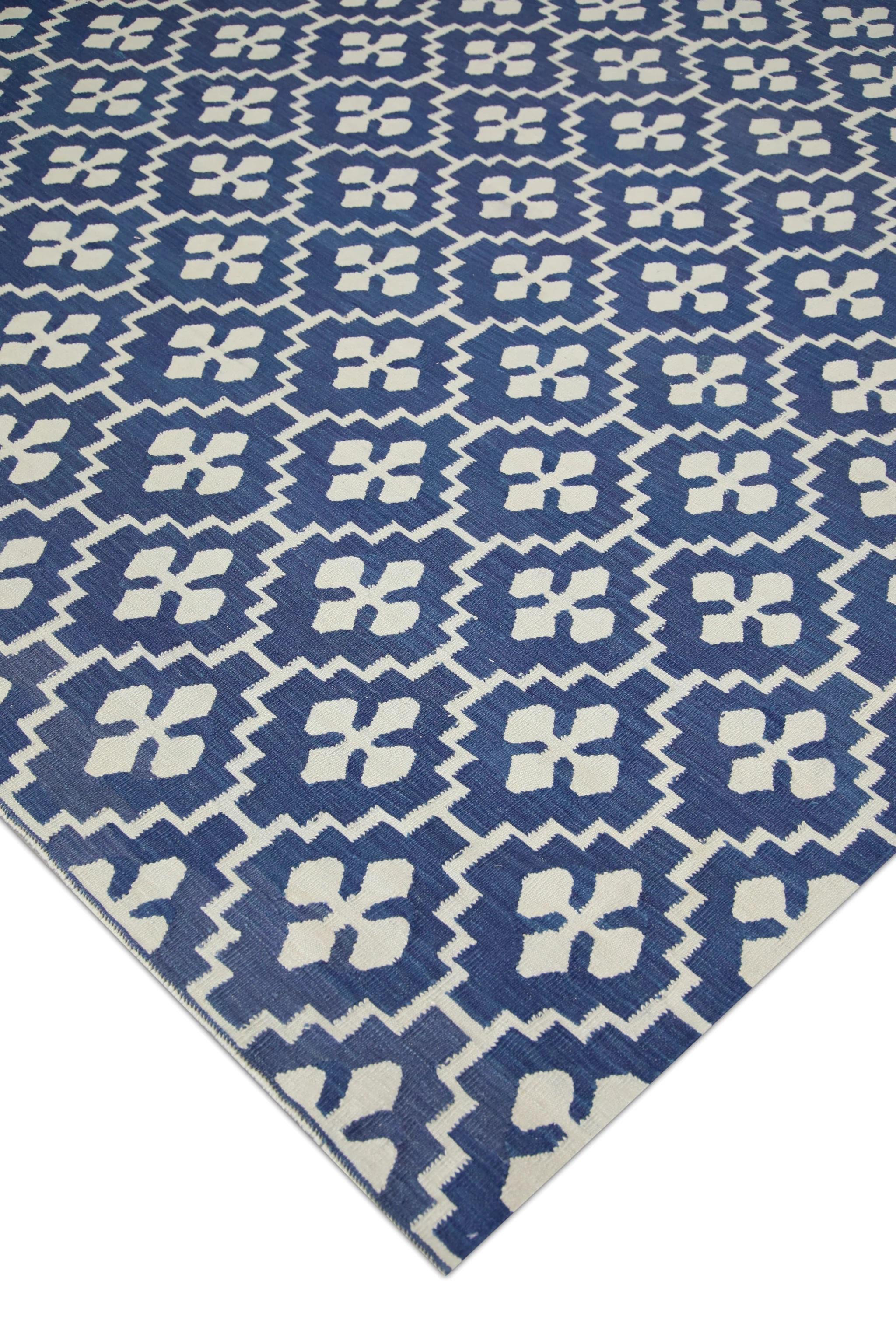 This exquisite Turkish flatweave Kilim rug showcases traditional craftsmanship at its finest. Meticulously handwoven by skilled artisans, the rug features a mesmerizing array of geometric motifs in vibrant blue tones, reflecting the rich cultural