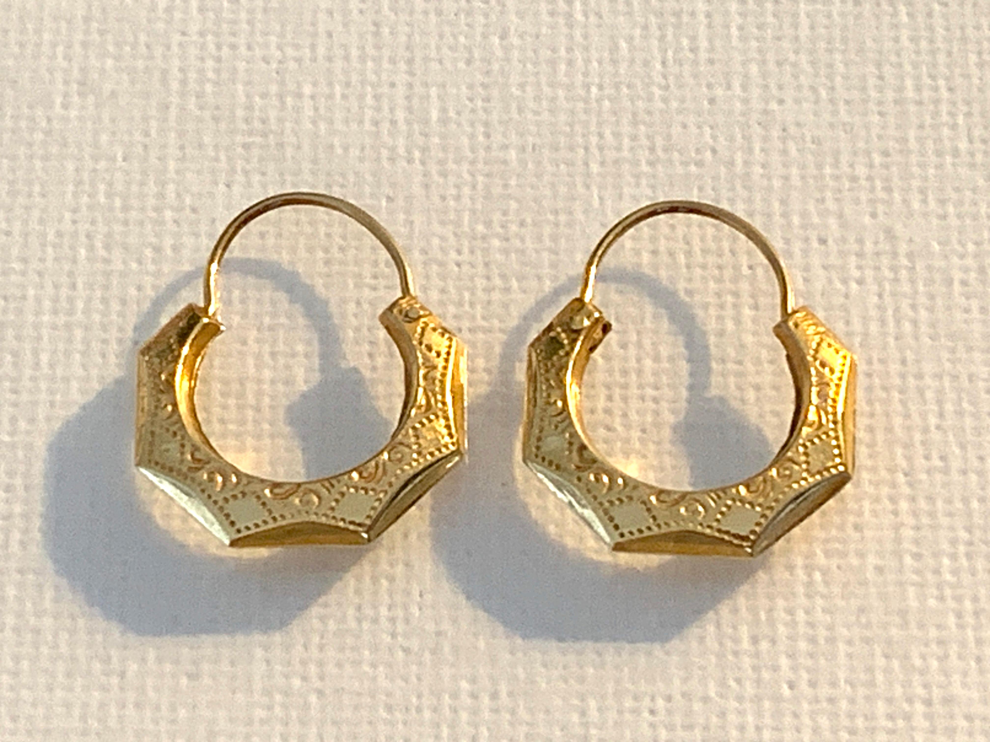 Vintage Circa Mid 20th Century
origin : Turkey

14ct 585 Gold Handcrafted Hexagon creoles
with surface hand impressed Hollow design

Stamped 14K by the screws on both earrings
Pull out - push in hook fastening
Weight 1.55 grams (