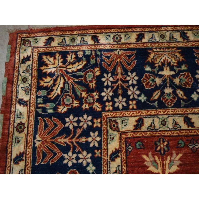 A modern hand knotted Turkish carpet of the highest quality. The carpet is a copy of a 19th century Mogul shrub design carpet. This carpet is beautifully drawn with an all over flowering shrub design in the most wonderful range of colours. The