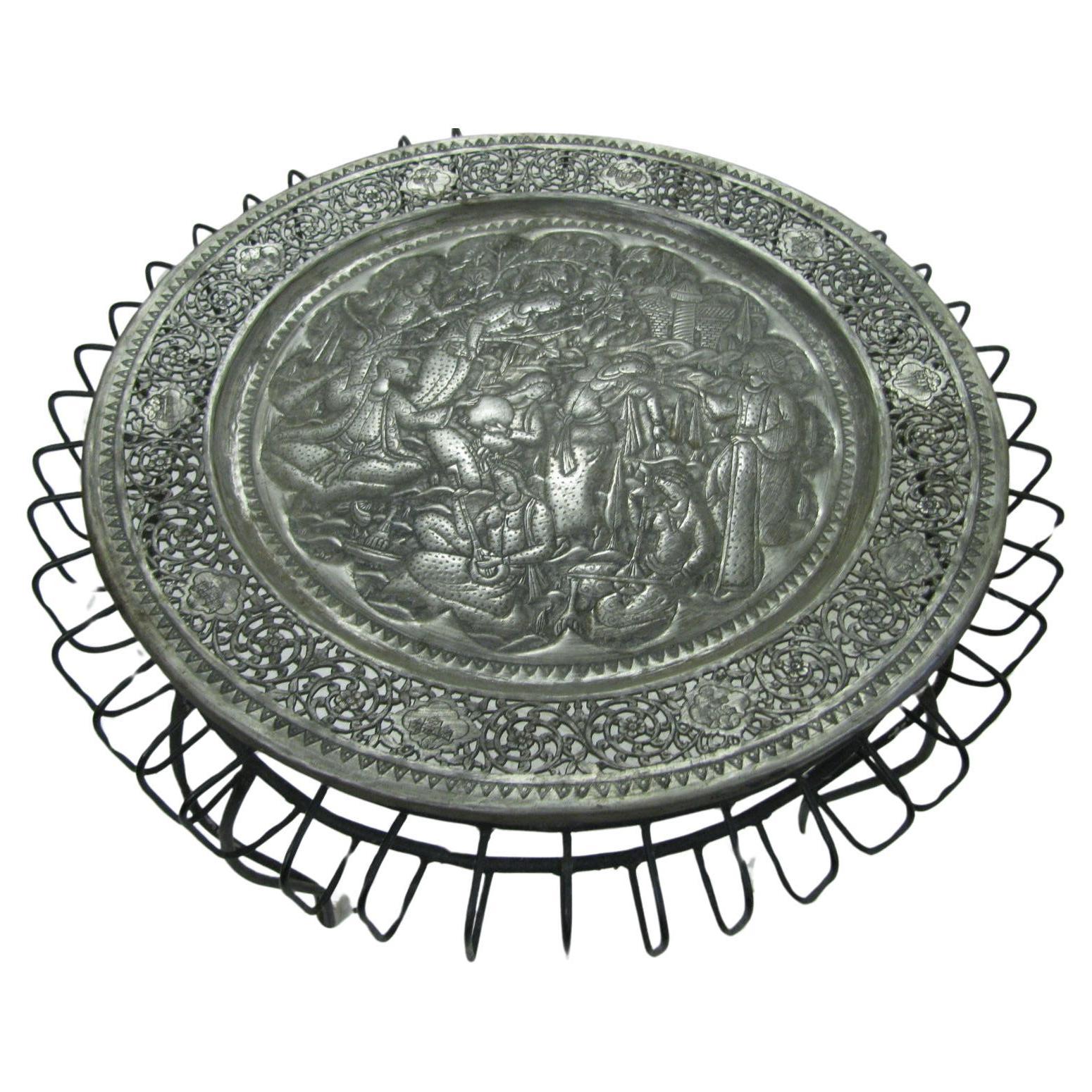 Fabulous large reticulated hand-hammered tray. Tin over copper with a stunning amount of hand hammered work. Scene with eight figures in a spiritual ceremony playing instruments and praying. Reticulated band surrounds the scene. Metalwork sits on a
