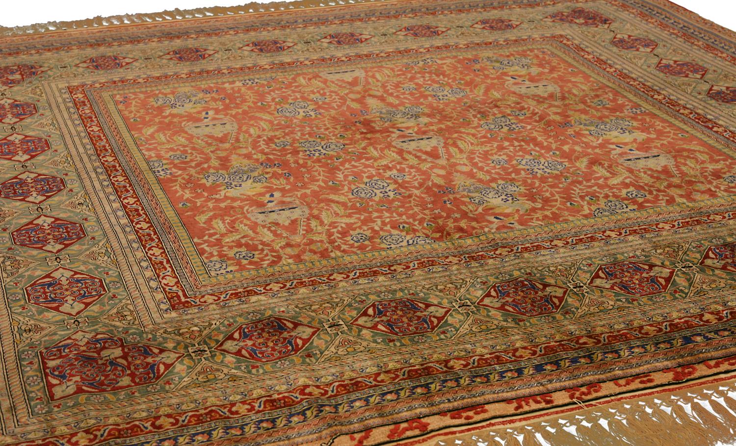 This is a modern Turkish Hereke silk metal thread rug woven in Turkey during the beginning of the 21st century circa 2000 – 2010. Its size is 204 x 190CM and has an all-over field design. What's unique about this rug is the scale of its borders