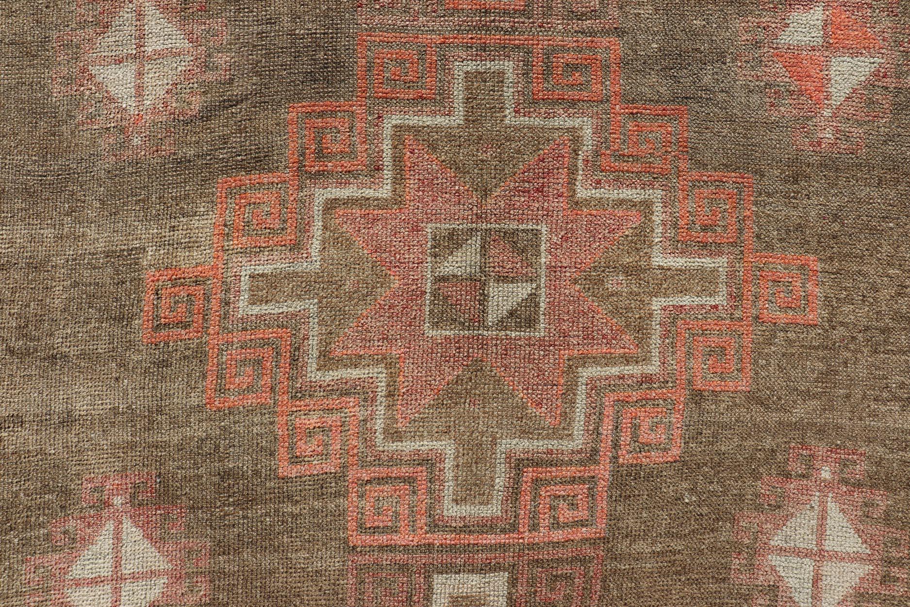 Vintage Hand Knotted Kars Gallery runner from Turkey with Medallion design in various tones of red, orange taupe. and brown. Keivan Woven Arts / rug EN-13243, country of origin / type: Turkey / Kars, circa 1940

Measures: 6'0 x 14'6.