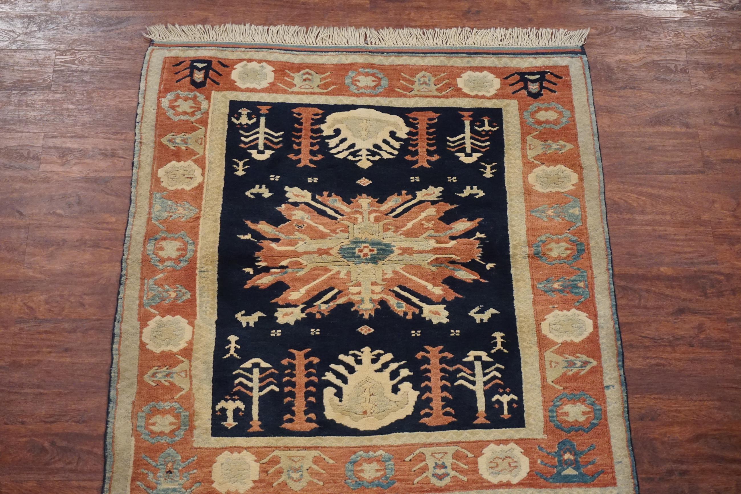 Turkish Kazak rug with people and dog motifs,

circa 1990

Measures: 4' 3