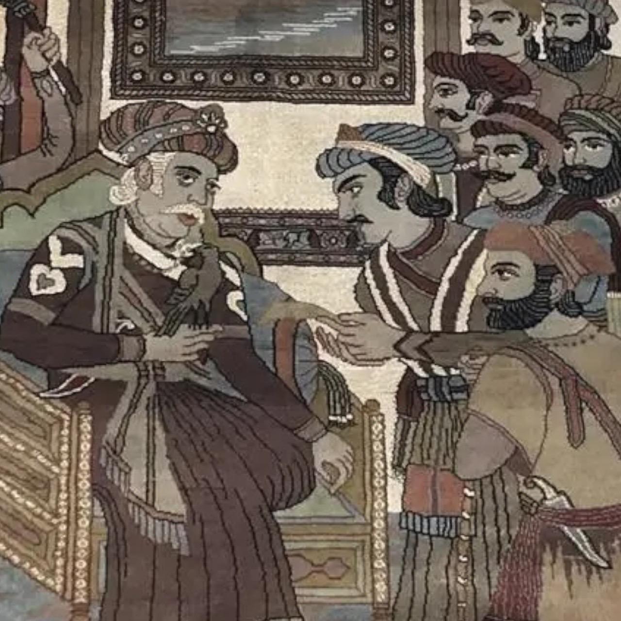 A mid century Turkish pictorial rug in the Kechan style. Decorated with a scene showing the Mughal emperor Jalaluddin Akbar holding court, with a bird on his hand. He is surrounded by several men who appear to be waiting to be received. The