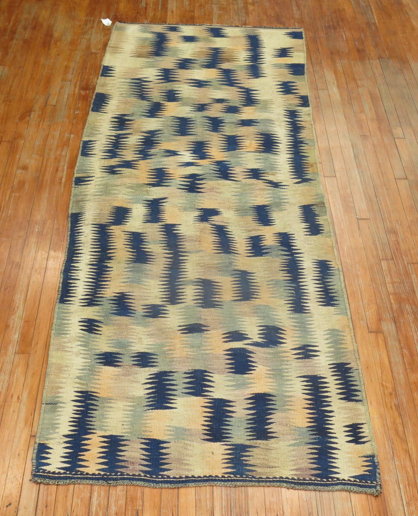 A primitive midcentury Turkish Kilim.

Measures: 4' x 9'7