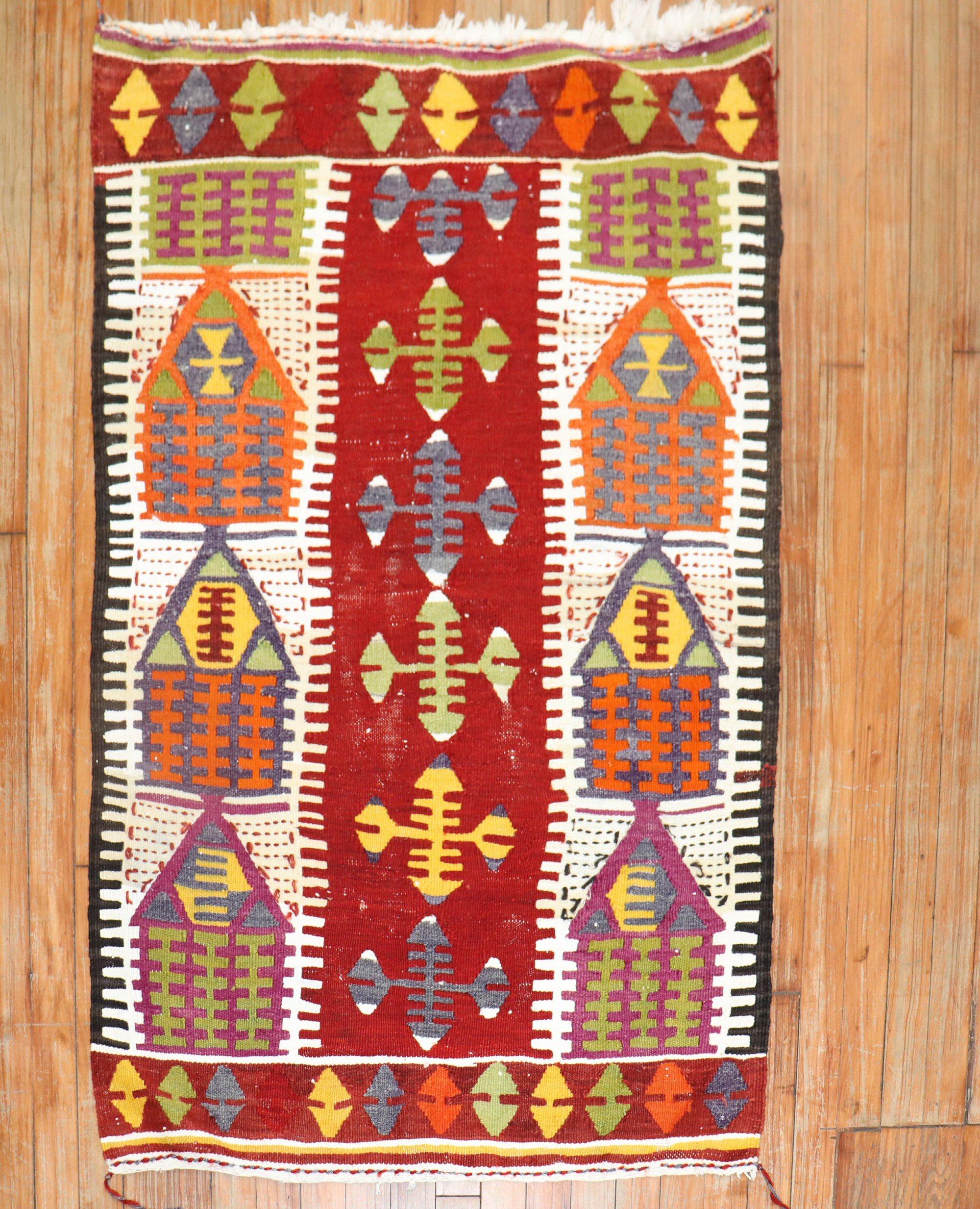 Mid 20th century Turkish Kilim with a directional prayer motif in bright colors

Measures: 2'10'' x 4'4''.