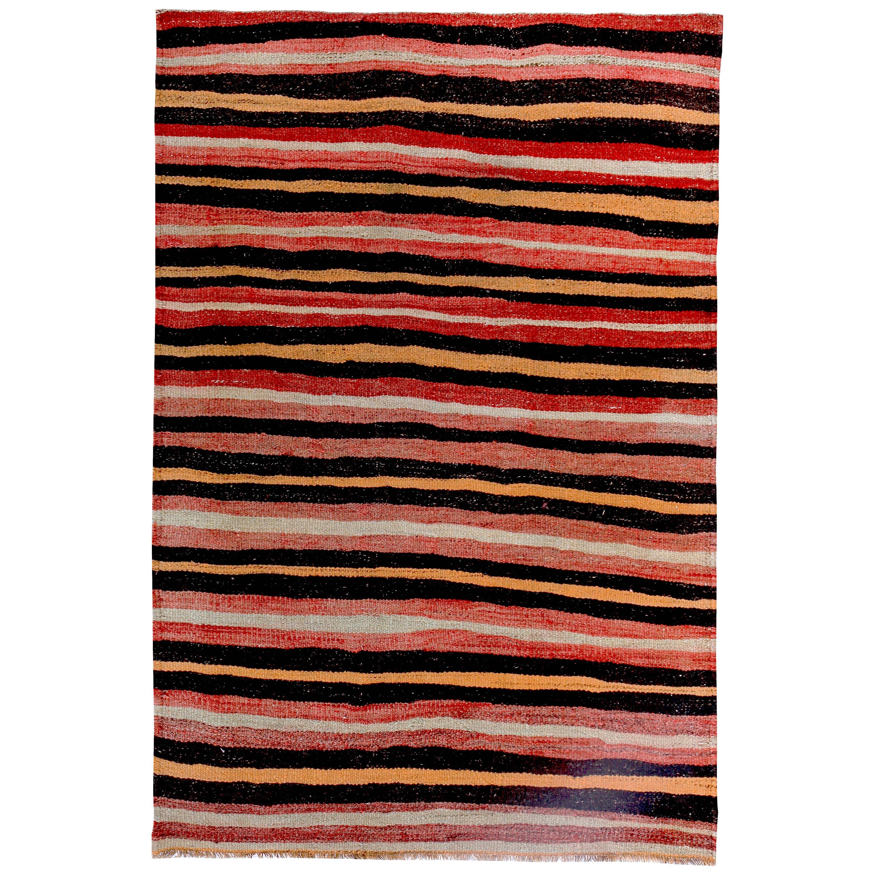 Turkish Kilim Rug with Black and Orange Stripes on Red and Ivory Field For Sale