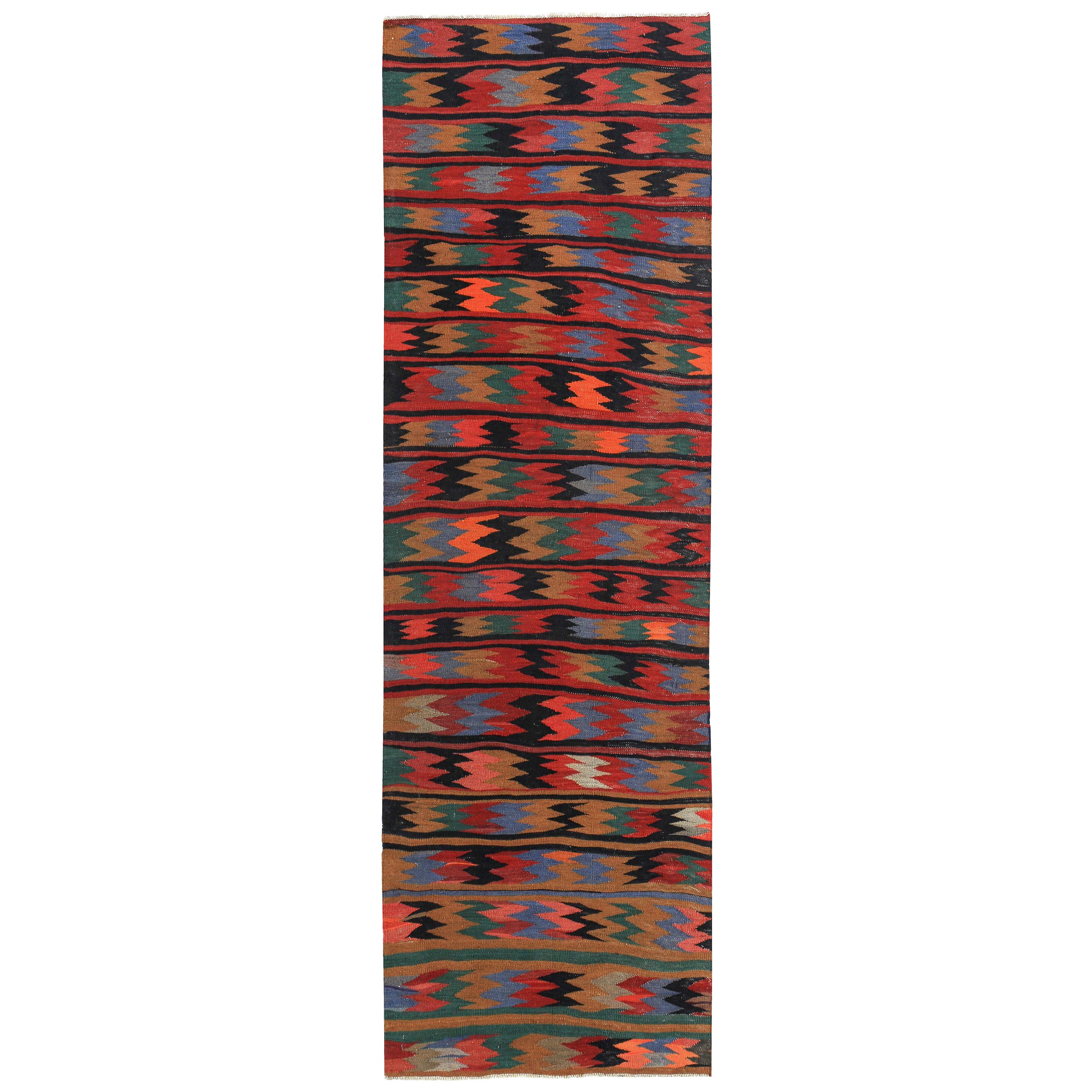 Türkischer Kelim-Teppich mit farbigen Zickzackstreifen auf rotem Feld