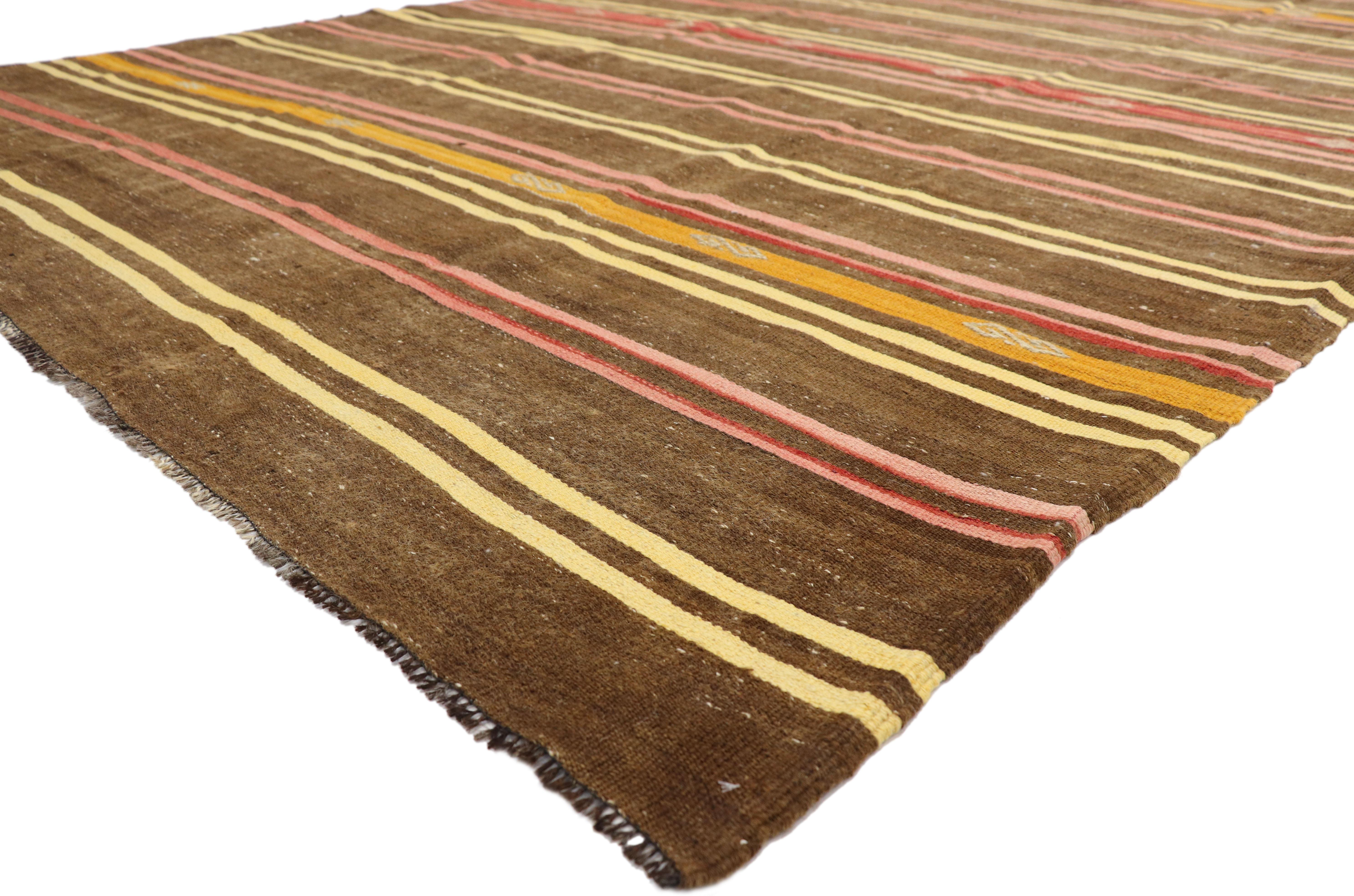 51075 Vintage Turkish Kilim Rug with Bohemian Tribal Design and Modern Cabin Style. Create a comfortable and modern setting with this hand-woven wool vintage Turkish Kilim rug. The flat-weave kilim rug features a few symbolic tribal motifs and