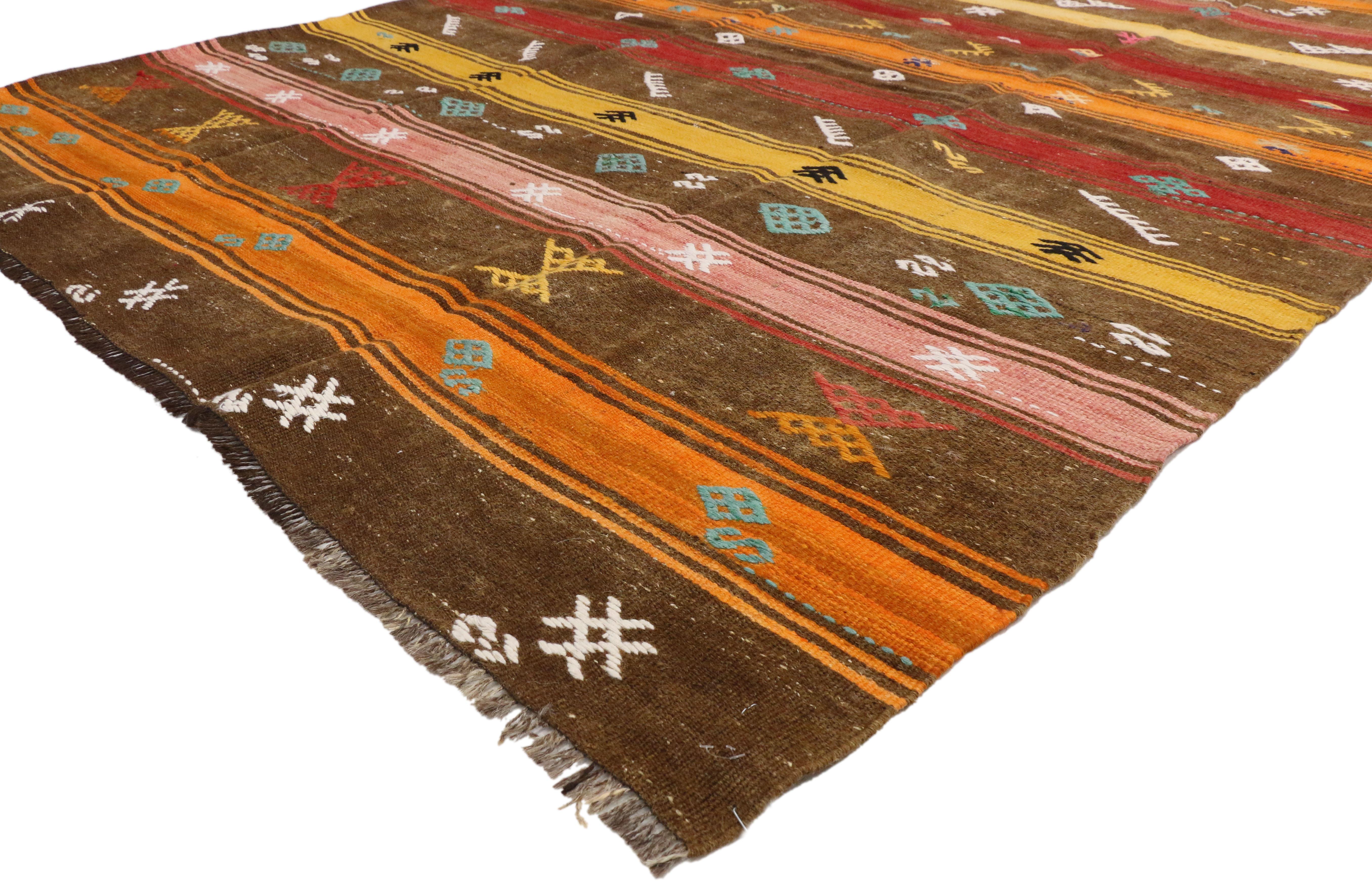 51074 Vintage Turkish Kilim Rug with Bohemian Tribal Design and Modern Cabin Style. Create a comfortable and modern setting with this hand-woven wool vintage Turkish Kilim rug. The flat-weave kilim rug features a variety of symbolic tribal motifs