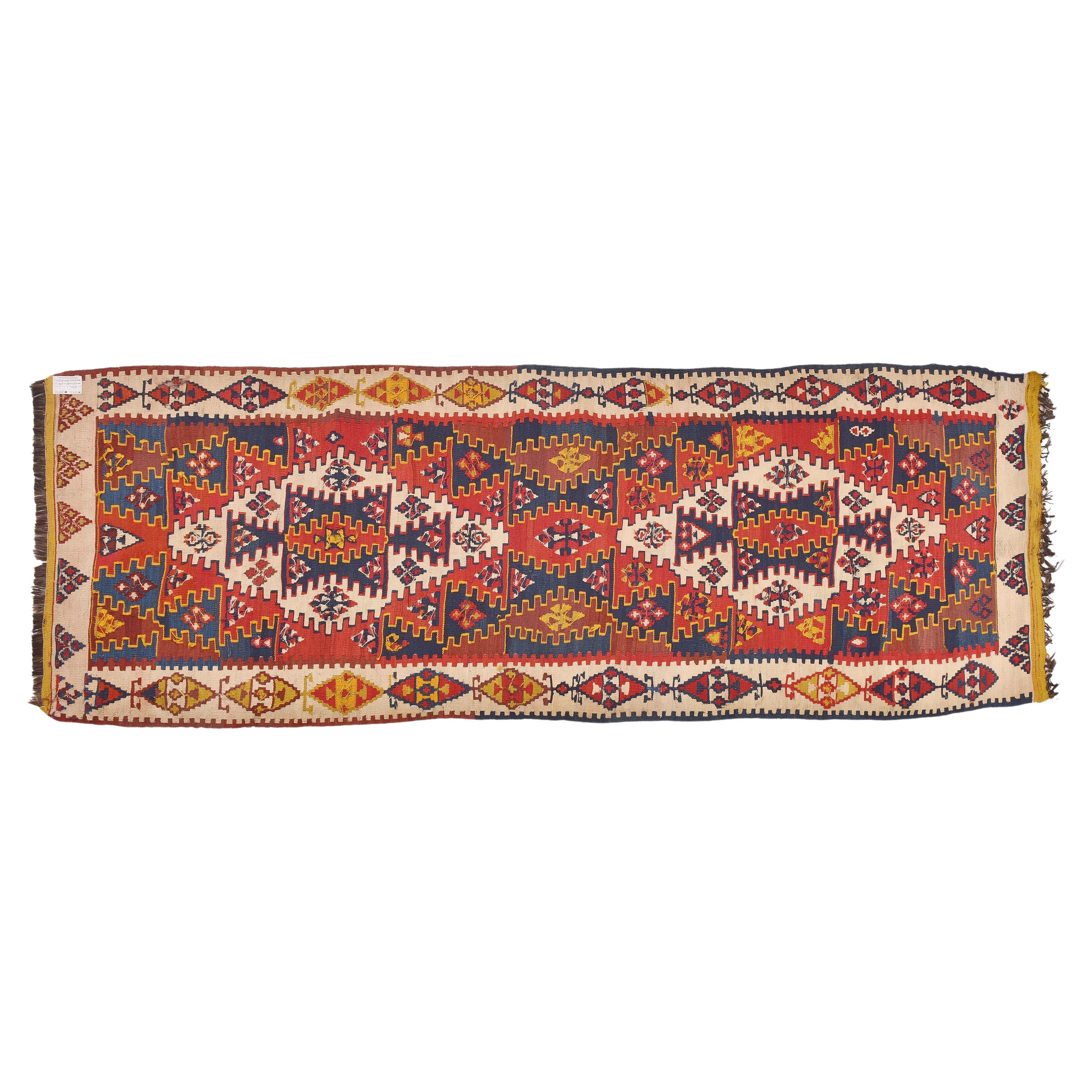 nr. 420 - Beautiful vintage kilim runner: with a red background, a blue and yellow geometric design and two large clear medallions.  Clear border and yellow details liven it up everywhere.
Accurate workmanship.  Beautiful even when hung.
 With a