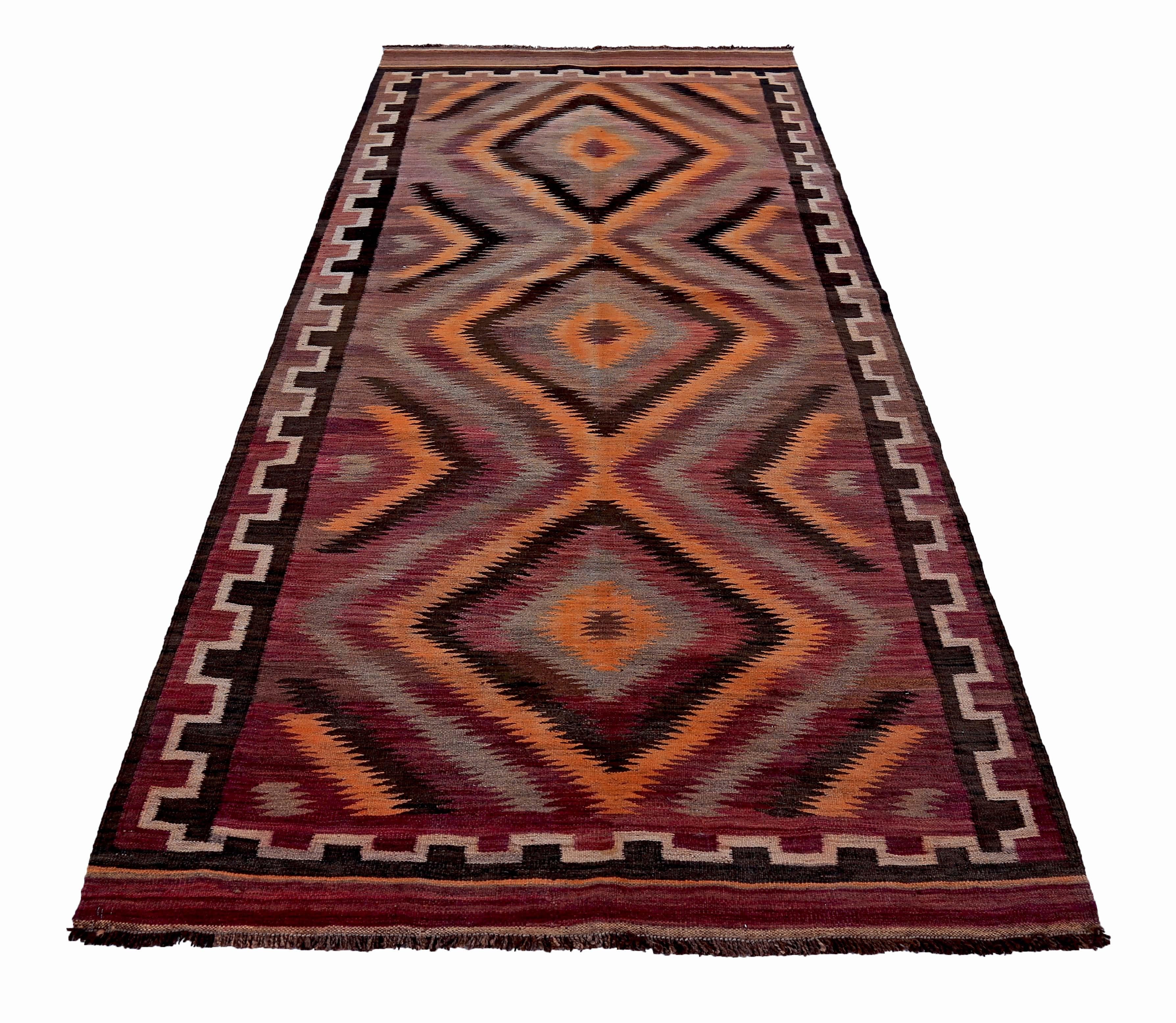 Modern Turkish rug handwoven from the finest sheep’s wool and colored with all-natural vegetable dyes that are safe for humans and pets. It’s a traditional Kilim flat-weave design in orange, brown and black. It’s a stunning piece to get for modern,