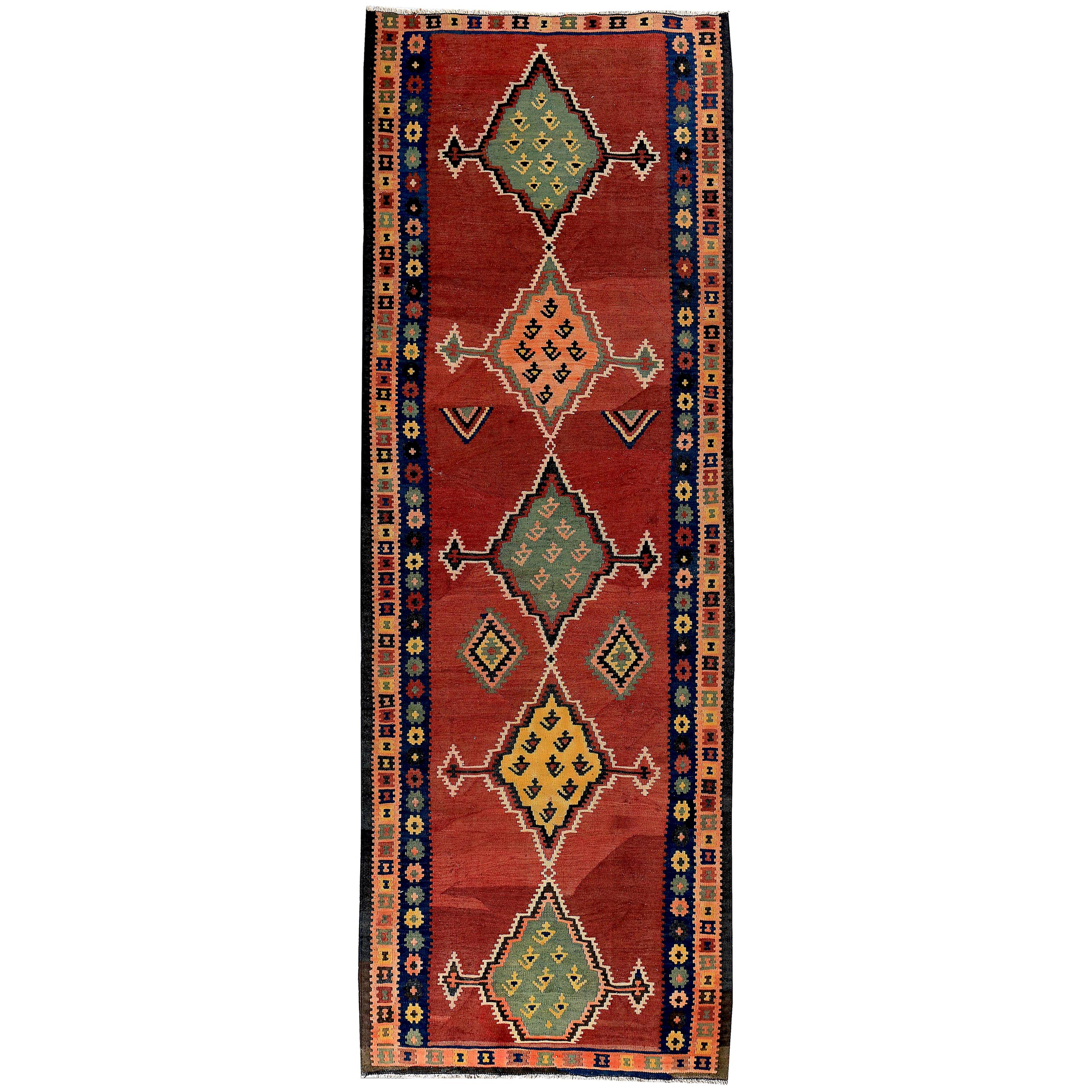 Turkish Kilim Runner Rug with Green and Yellow Tribal Medallions on Red Field For Sale