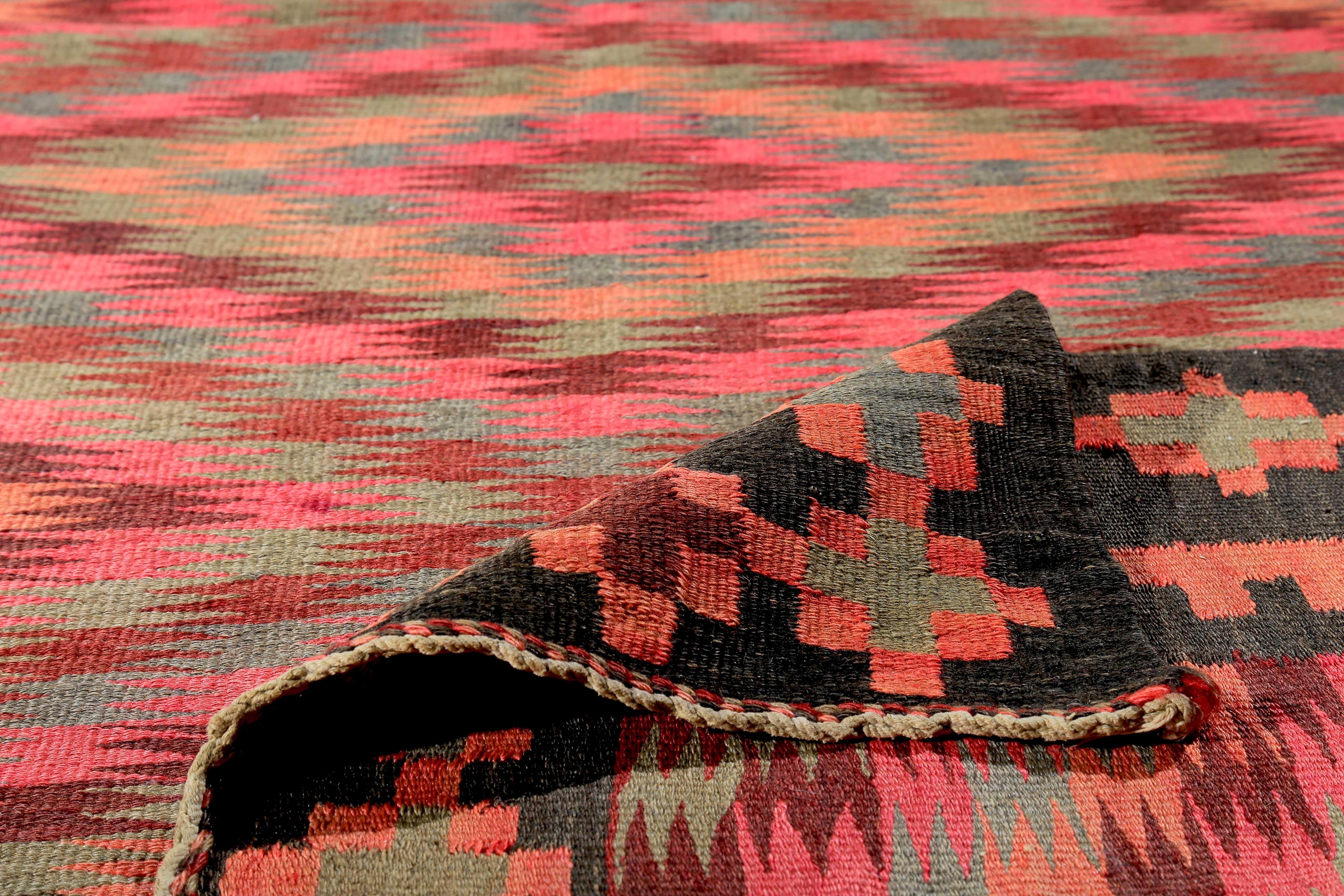 Hand-Woven Turkish Kilim Runner Rug with Green and Pink Tribal Details on Black Field For Sale