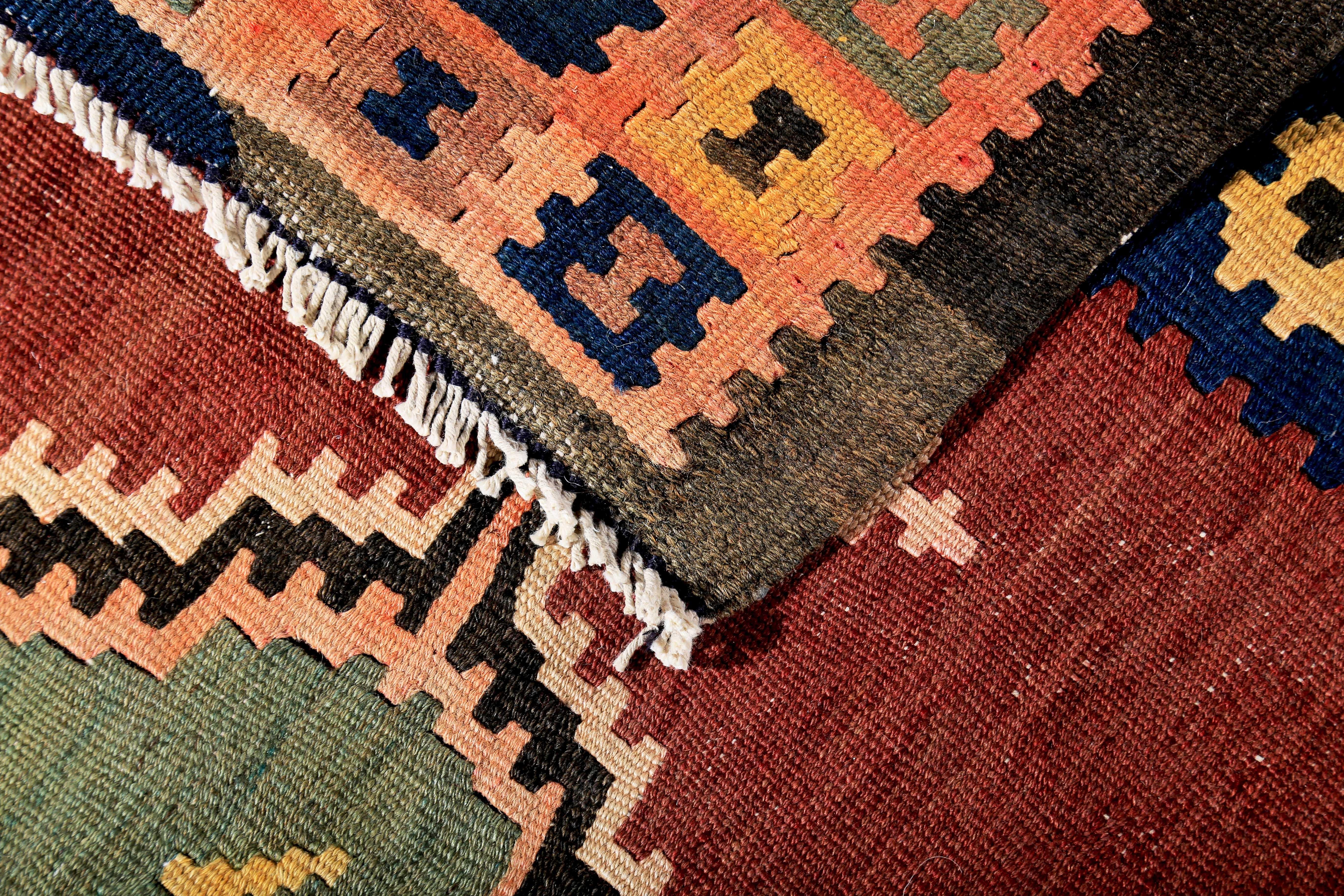 Hand-Woven Turkish Kilim Runner Rug with Green and Yellow Tribal Medallions on Red Field For Sale