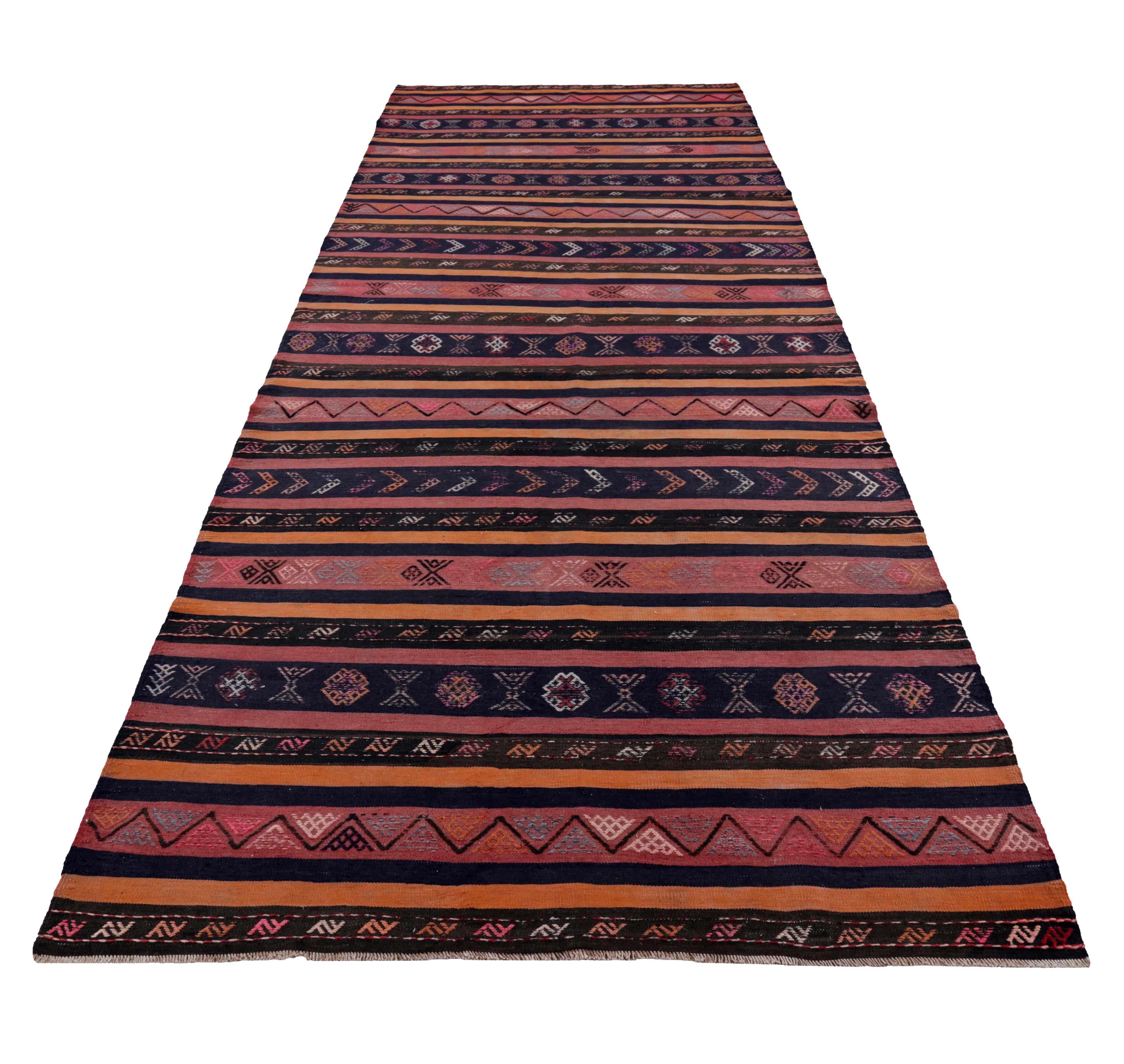 Turkish rug handwoven from the finest sheep’s wool and colored with all-natural vegetable dyes that are safe for humans and pets. It’s a traditional Kilim flat-weave design featuring orange, blue, red and black diamond patterns. It’s a stunning
