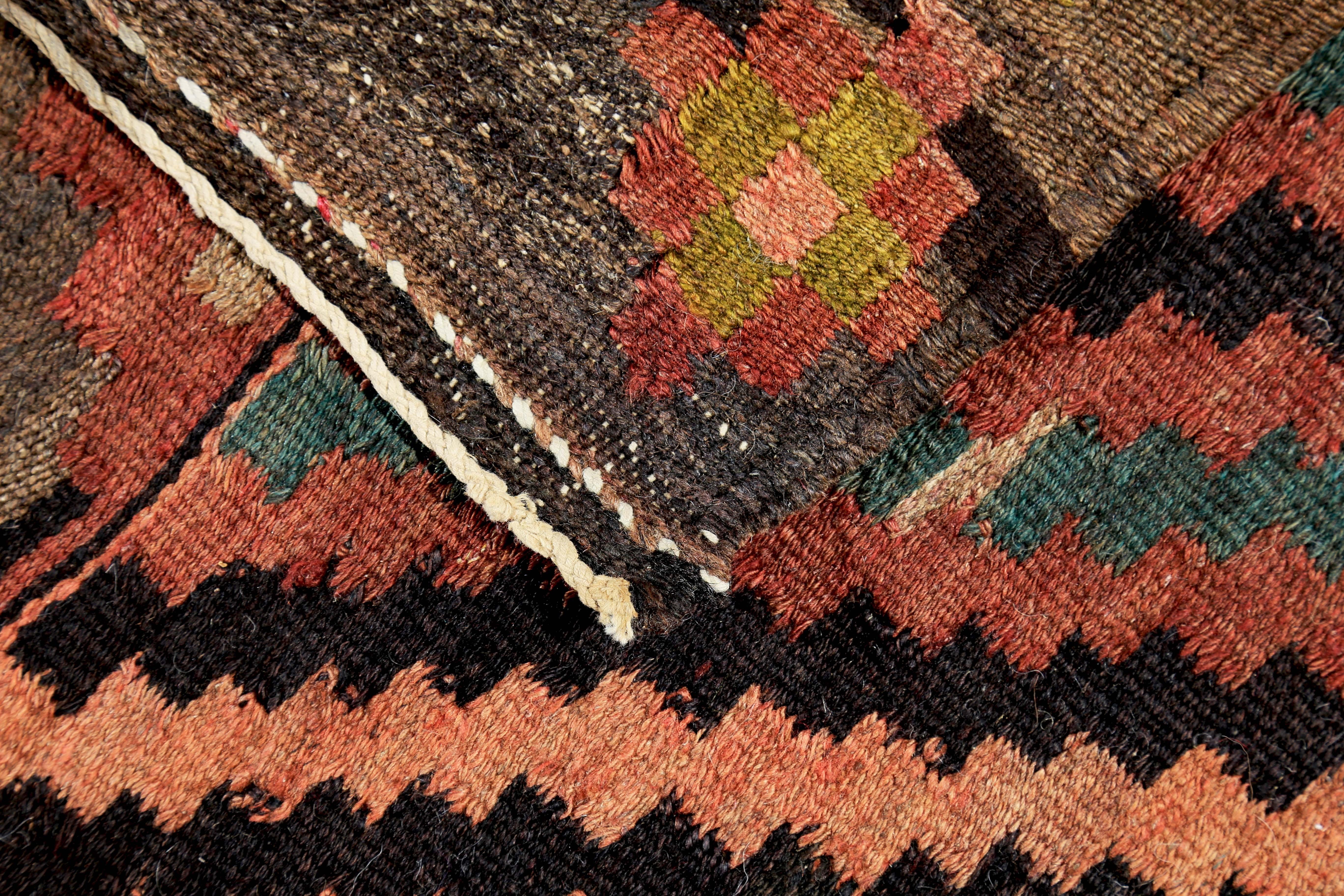 Wool Turkish Kilim Runner Rug with Pink and Green Tribal Details on Brown Field For Sale