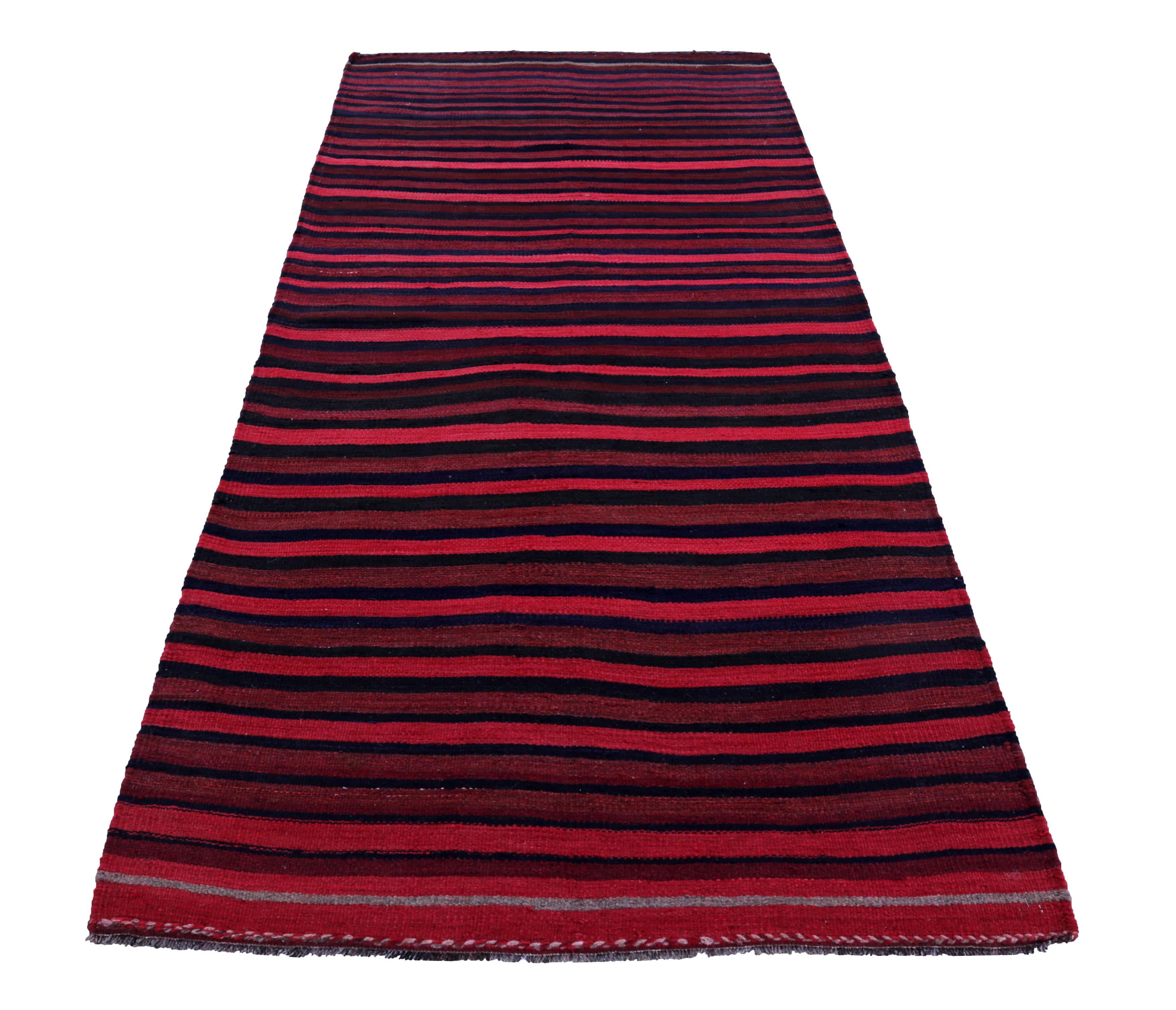 Turkish rug handwoven from the finest sheep’s wool and colored with all-natural vegetable dyes that are safe for humans and pets. It’s a traditional Kilim flat-weave design featuring pink, navy and red stripe patterns. It’s a stunning piece to get