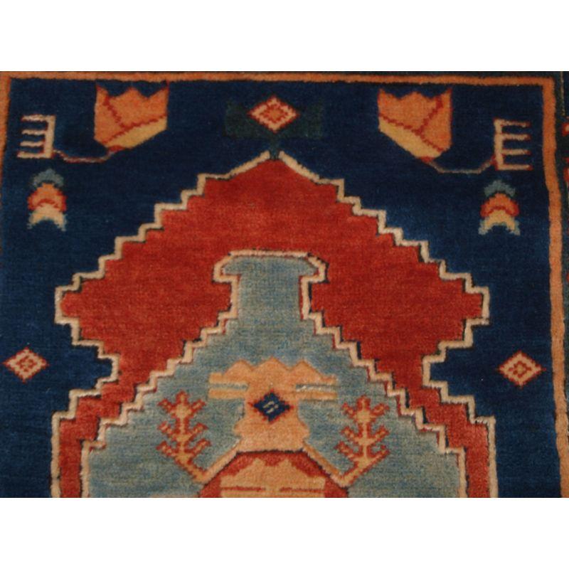 A good example of a Turkish Konya design carpet of modern production hand knotted in Turkey.

New and unused.

Traditional medallion design with soft pastel colours on a indigo blue field.

The rug is offered in perfect condition with no wear at all