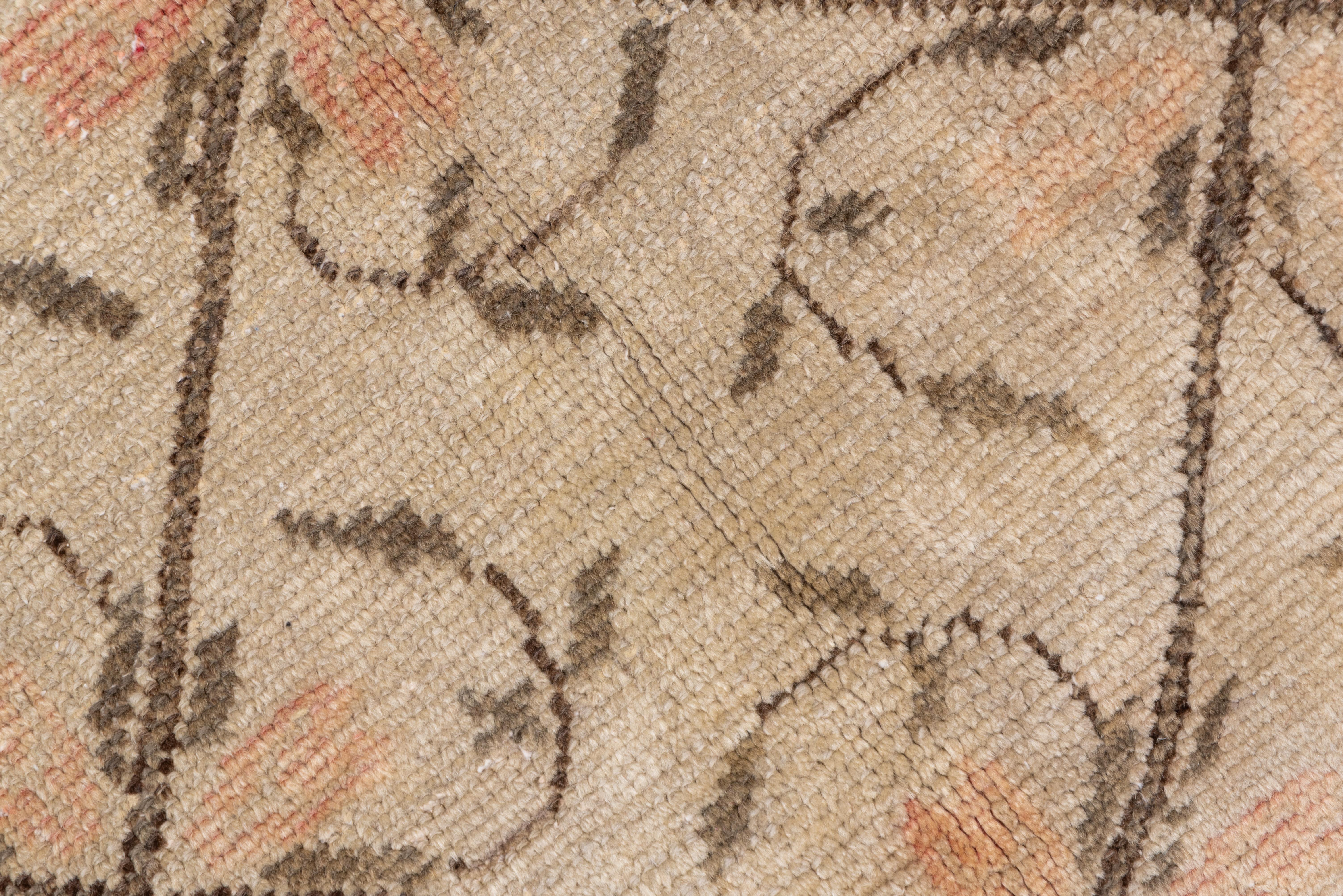 From Konya, this borderless long rug shows a Mid-Century Modern all-over pattern of an open brown lattice with each cell enclosing four leafy thin volute stems on a sandy ground.
 