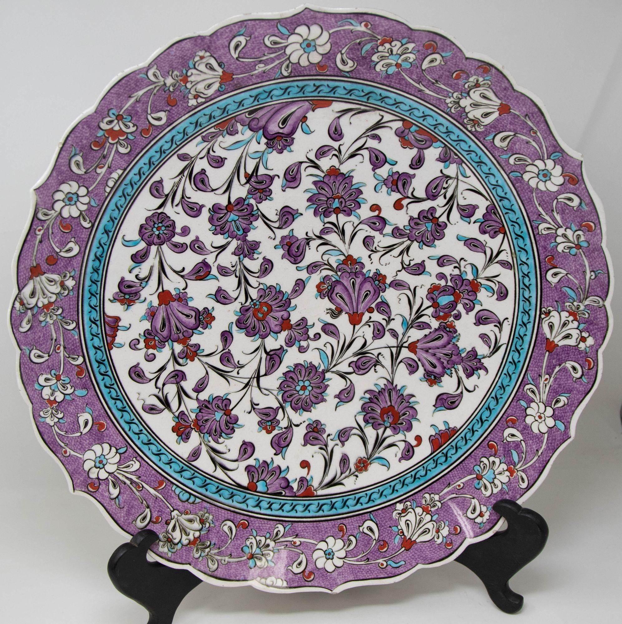 Mid 20th Century Turkish Kütahya Pottery Hand Painted Wall Hanging Plate with Iznik Patterns.
Large hand-made decorative ceramic wall art platter hand painted in polychrome Izink pattern and numbered and signed by the artist.
Colorful Hand Painted