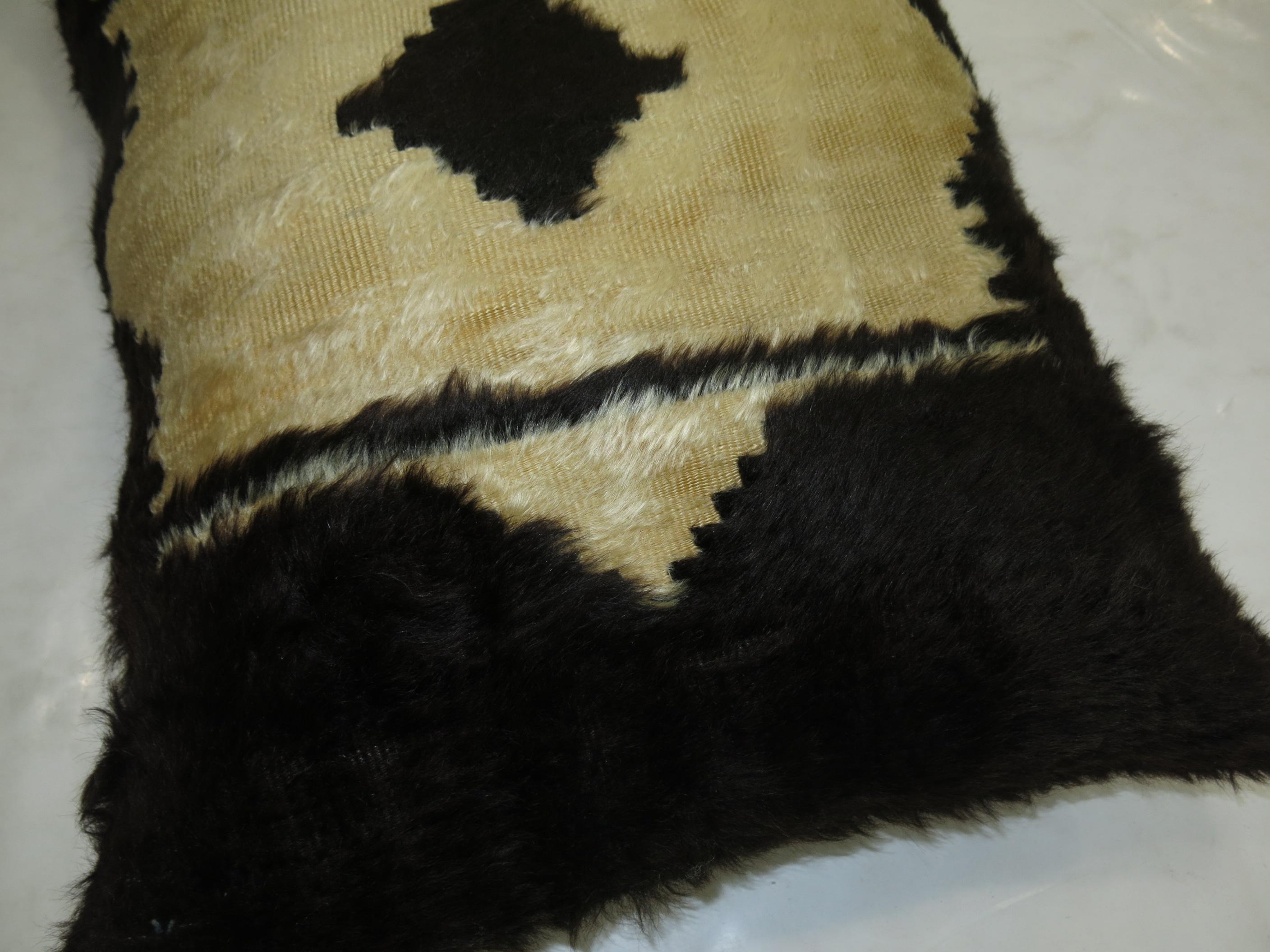 A pillow made with a Turkish Mohair rug.

20'' x 28''