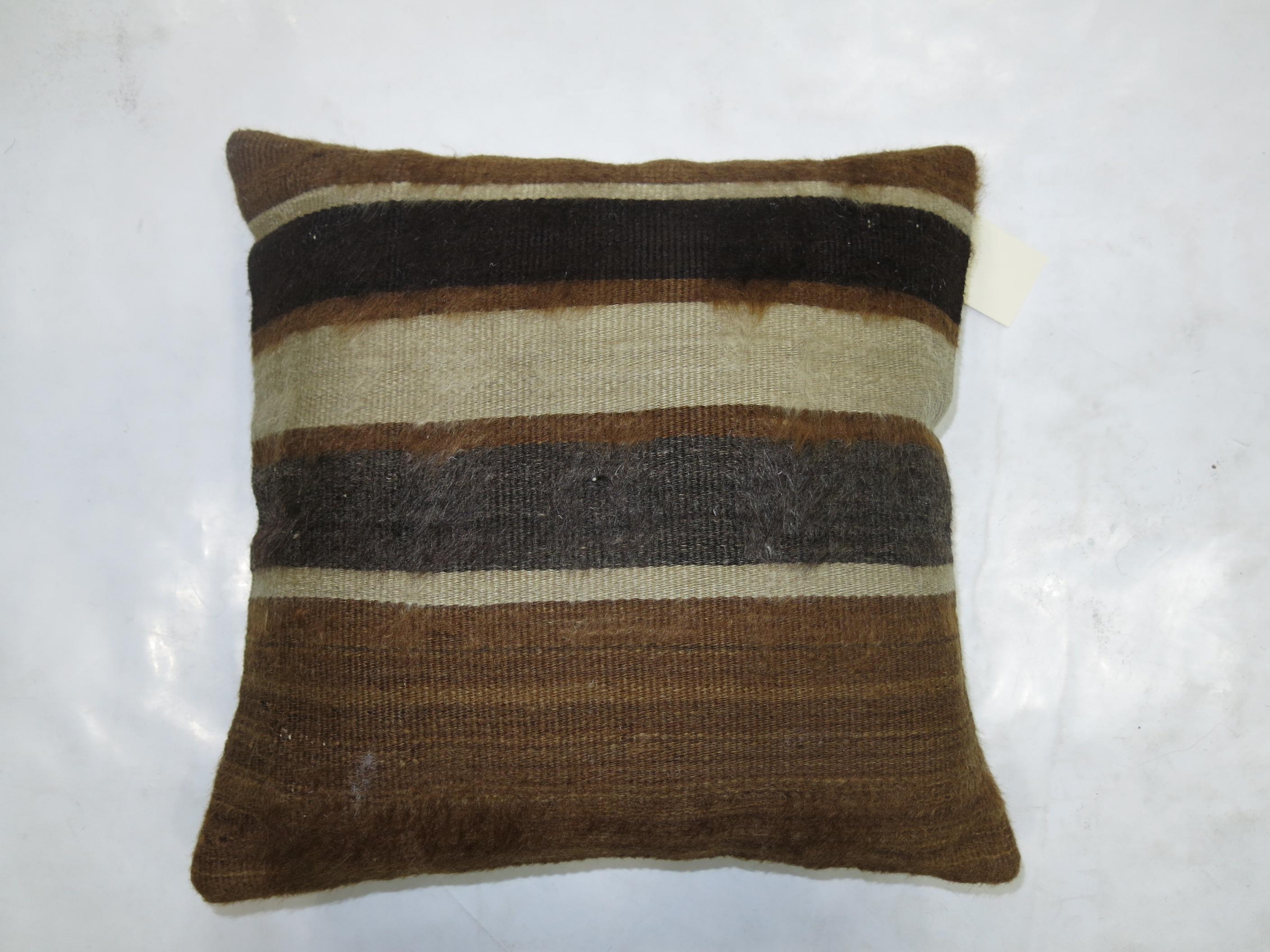 A small pillow made with a brown Turkish Mohair rug.

Measures: 1'3'' x 1'3''.
