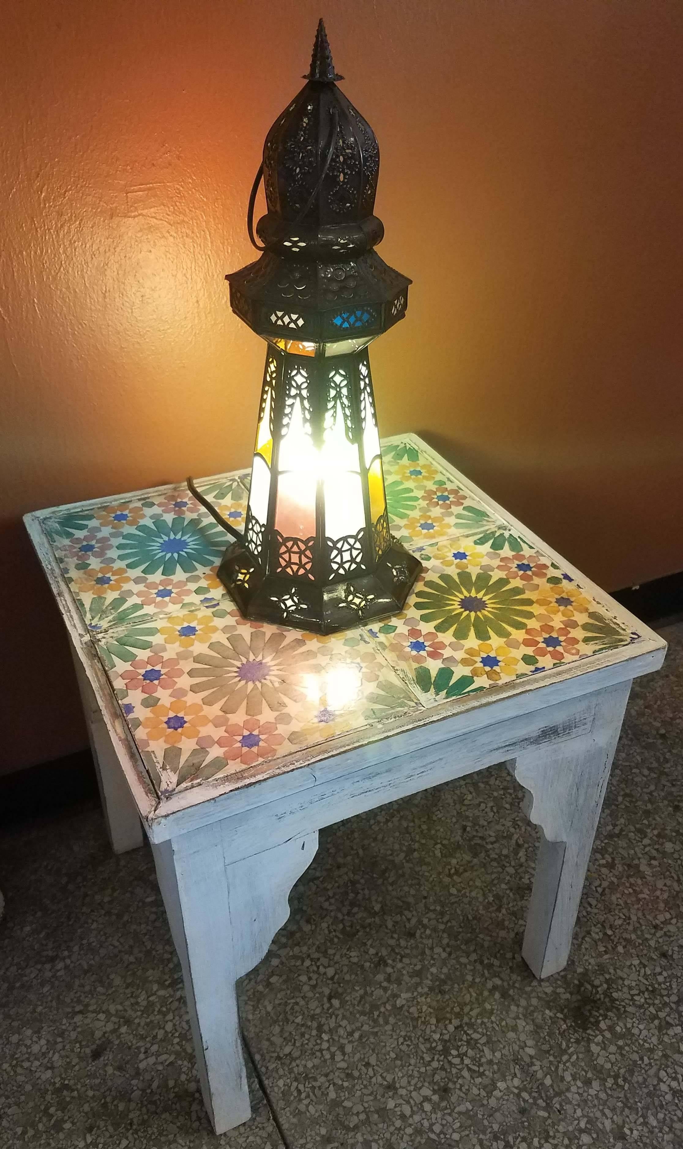Medium size Moroccan pierced metal lantern, Lighthouse style with multi-color frosty glass on a copper stained frame, measuring approximately 17