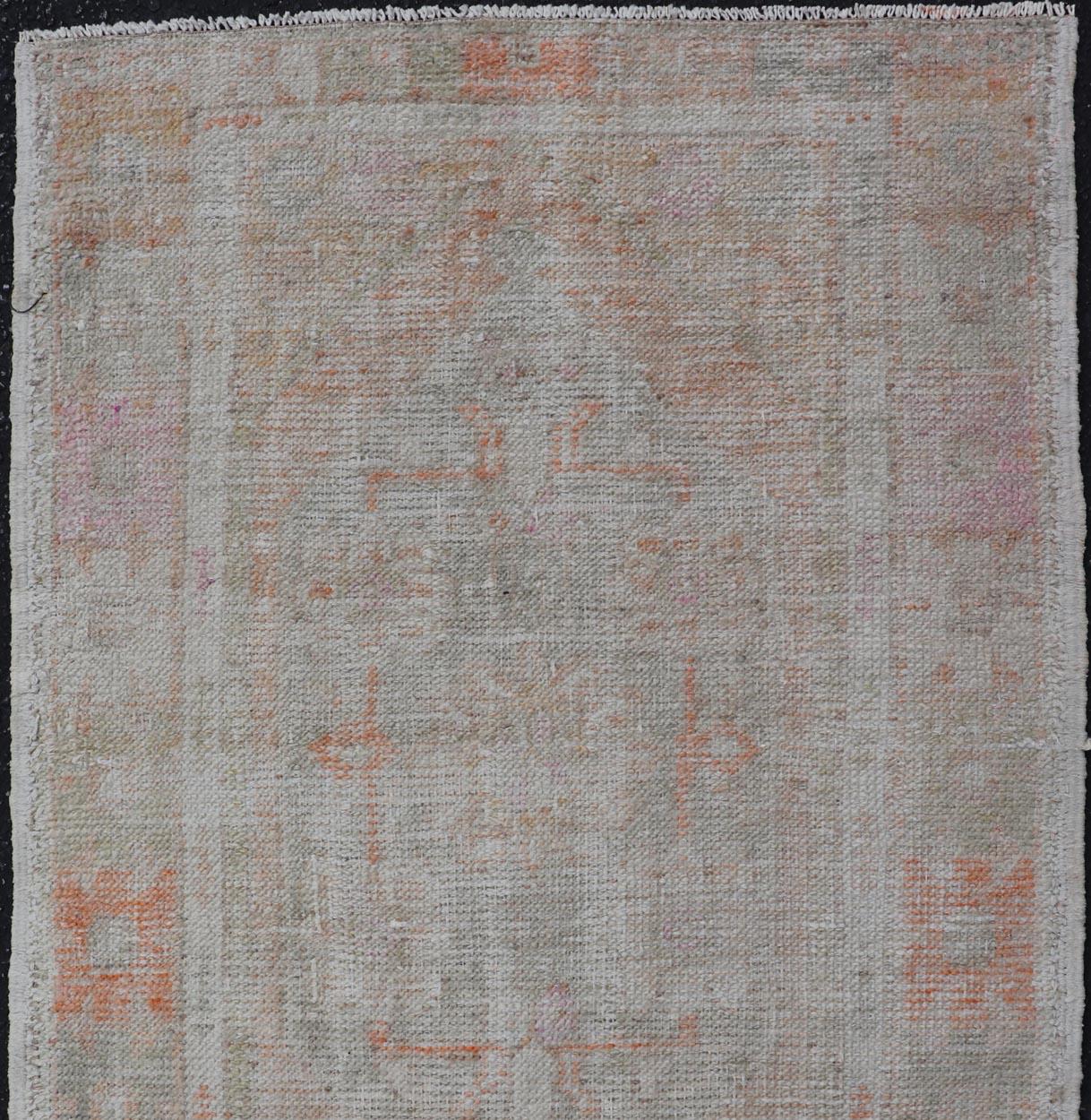 Hand-Knotted Turkish Muted Colored Oushak Rug is Subdued Medallion Design For Sale