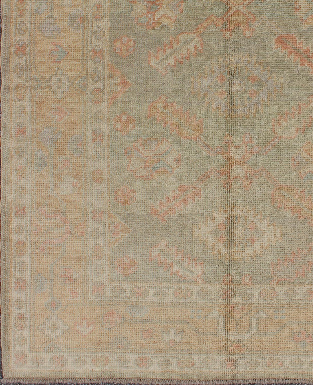 New Turkish Oushak rug with green and neutral color palette and all-over flower design, rug en-302, country of origin / type: Turkey / Oushak

This traditional Oushak rug from Turkey features a subdued, neutral color palette and an all-over design