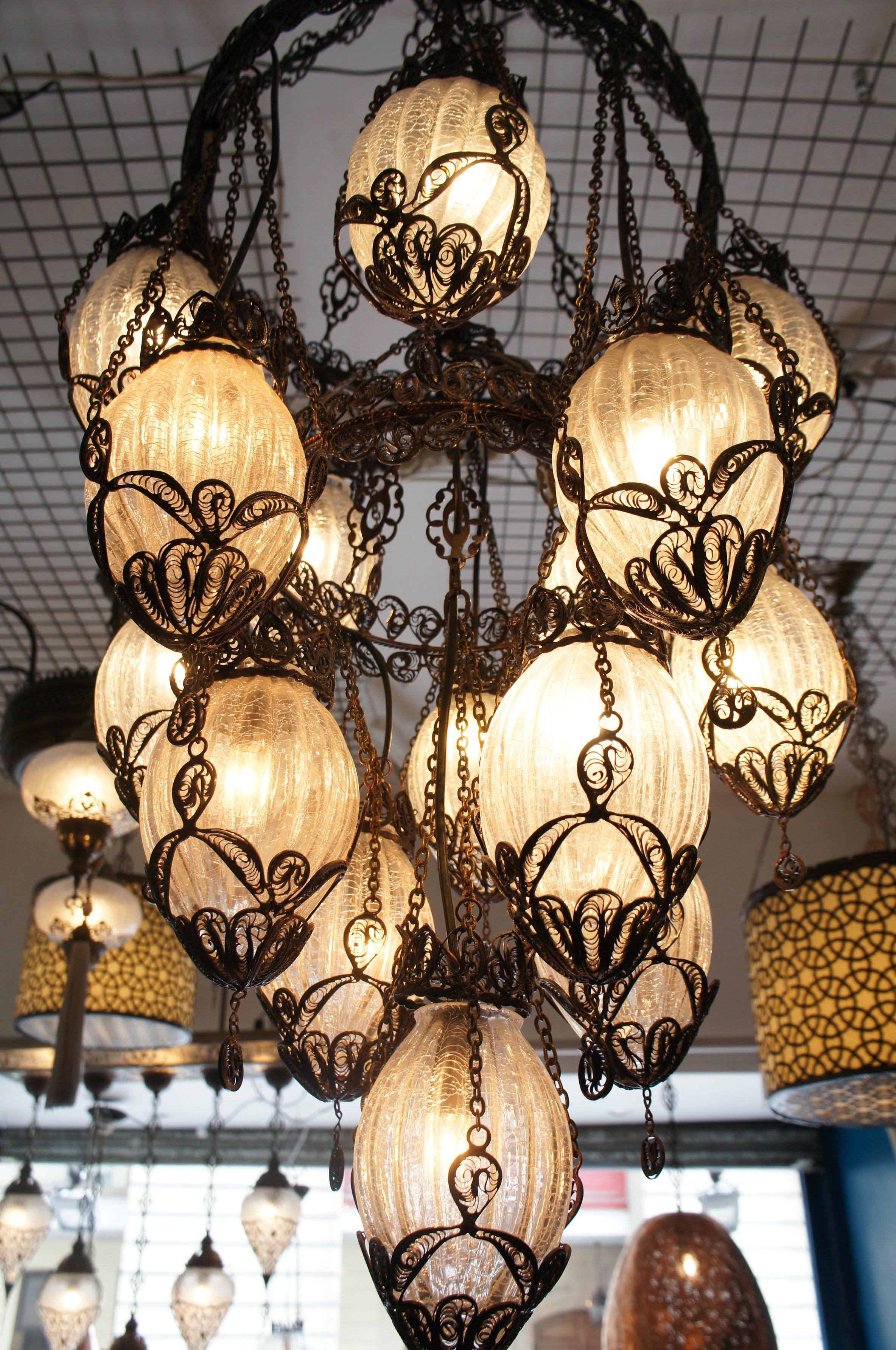 Beautiful Turkish ottoman chandelier 
This embellished beautiful delicate frame is handcrafted wrought iron.
Each globe is crafted hand from blown glass.
   