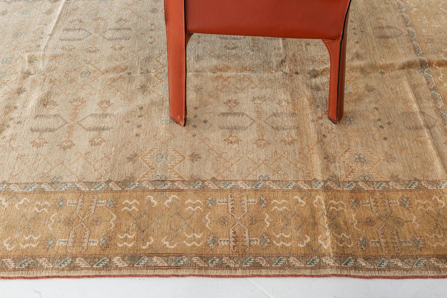 This luxurious revival Turkish rug features the majestic motifs and symbols of the allover design masterpiece. The borders are beautifully pile-woven created from wool to form a stunning Ottoman Design. A truly divine creation that best suits in