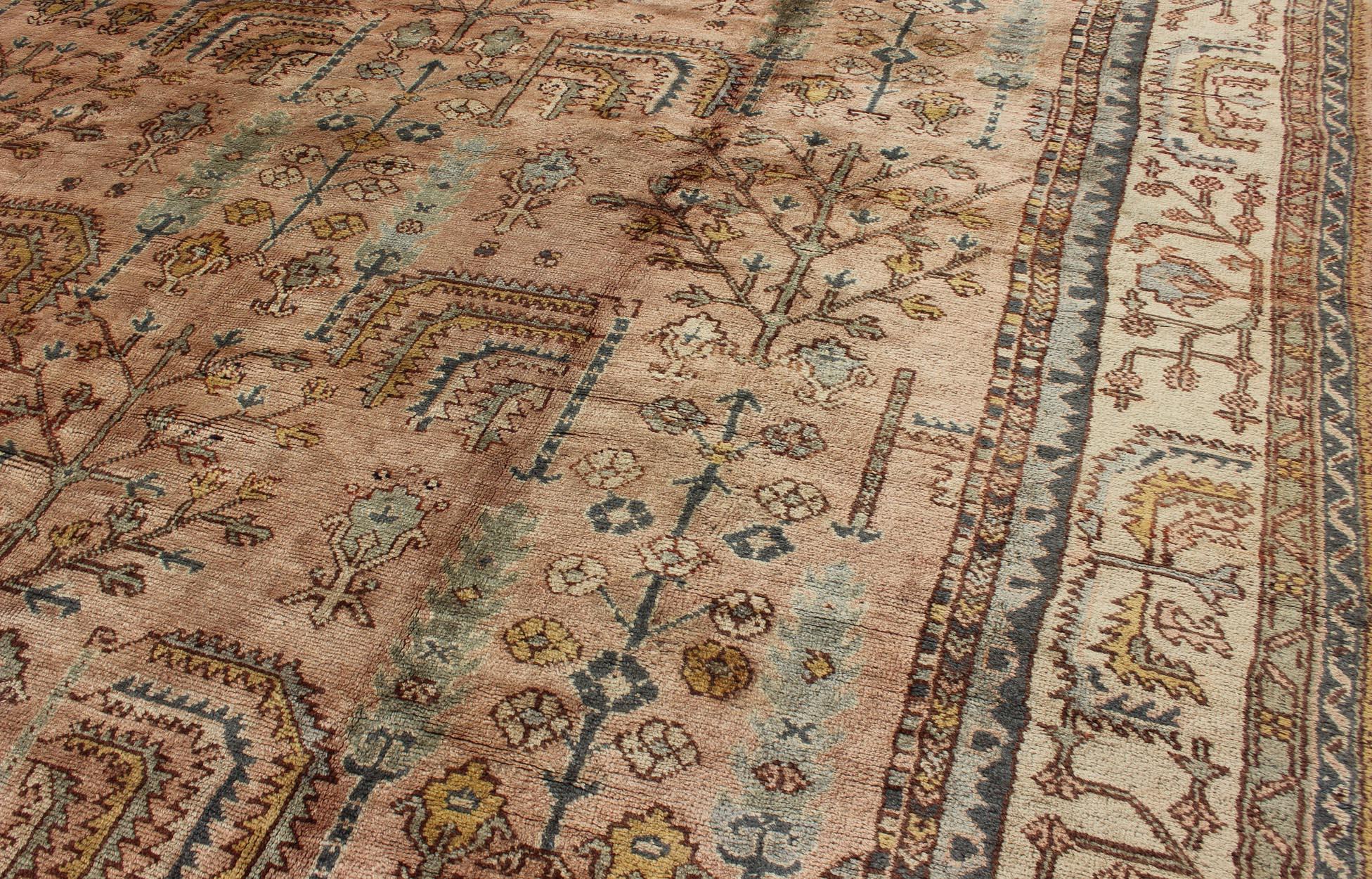 Early 20th Century Turkish Oushak Antique Rug with Botanical Design in Salmon, Blue and Brown