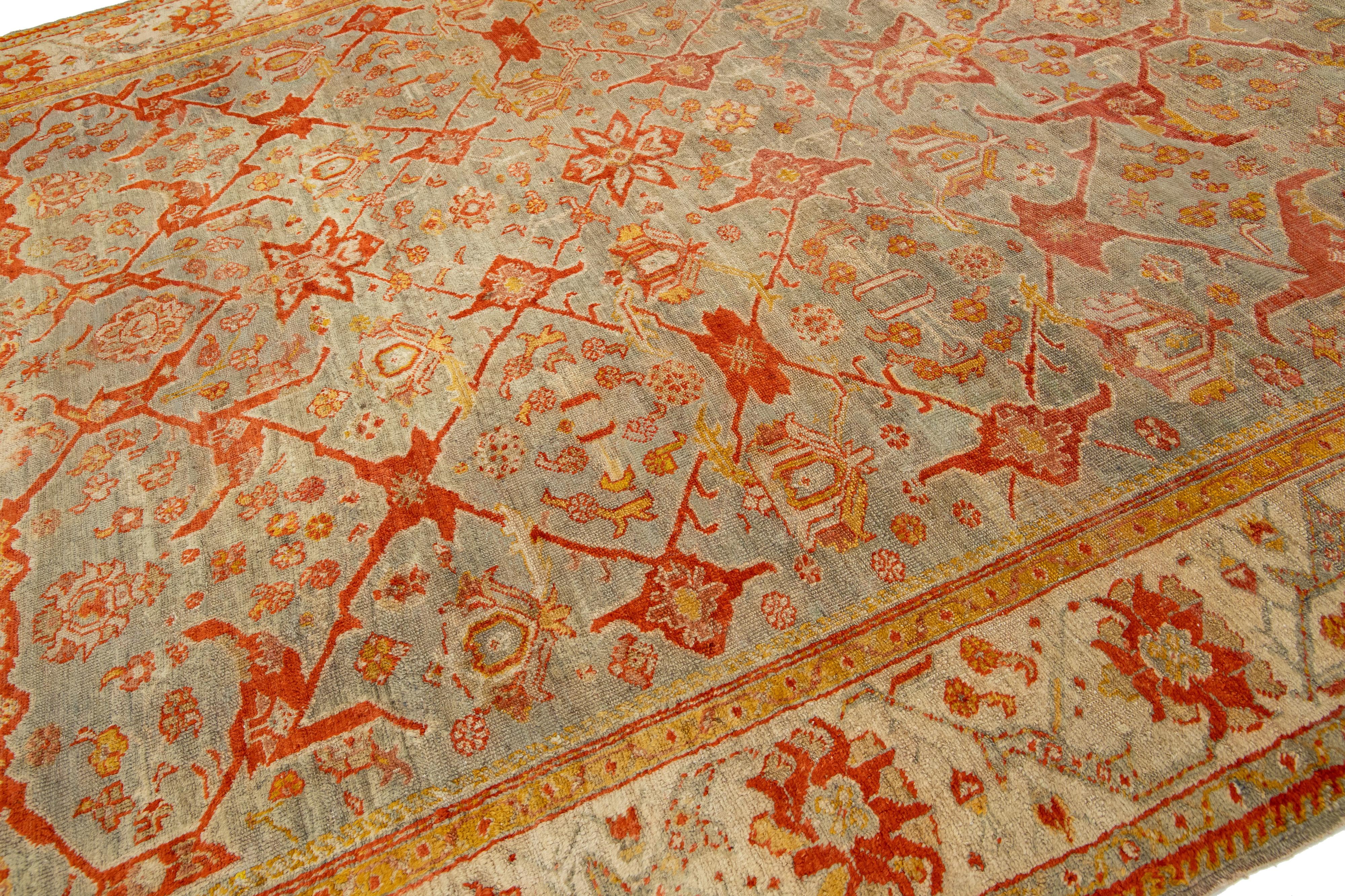 Hand-Knotted Turkish Oushak Antique Wool Rug Handmade Featuring a Floral Pattern In Rust  For Sale